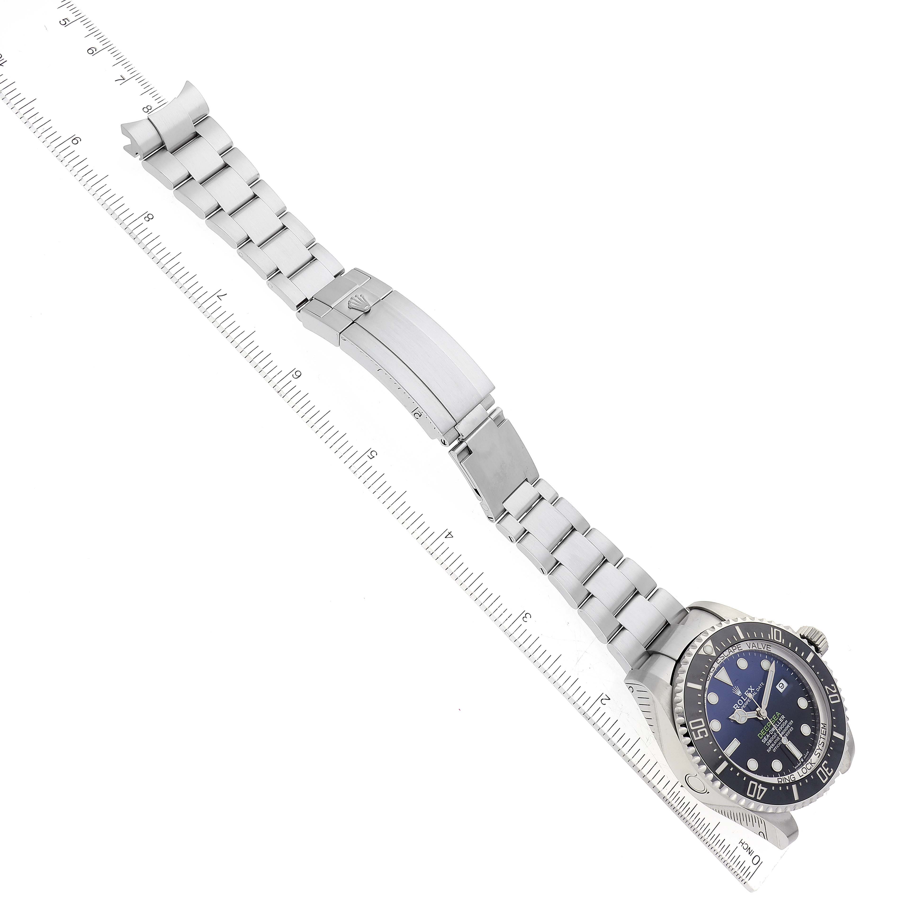 This image shows the Rolex Sea-Dweller 126660 Men
s Stainless Steel Blue Dial 126660 Men
s Stainless Steel Blue Dial watch at an angled top view, focusing on the dial and the full bracelet with the clasp.