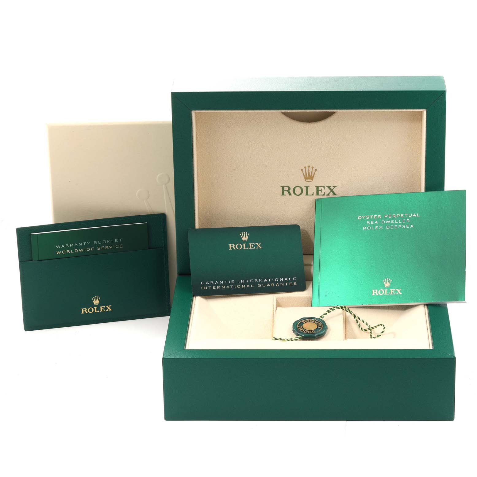The image shows the packaging box, warranty booklet, international guarantee card, and a tag for the Rolex Sea-Dweller 126660 Men
s Stainless Steel Blue Dial 126660 Men
s Stainless Steel Blue Dial watch.