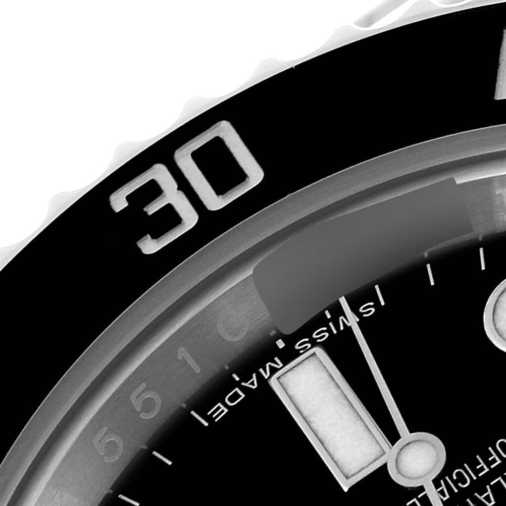 This image shows a close-up of the bezel, dial, and hands of a Rolex Submariner 114060 Men's Stainless Steel Black Dial 114060 Men's Stainless Steel Black Dial watch.