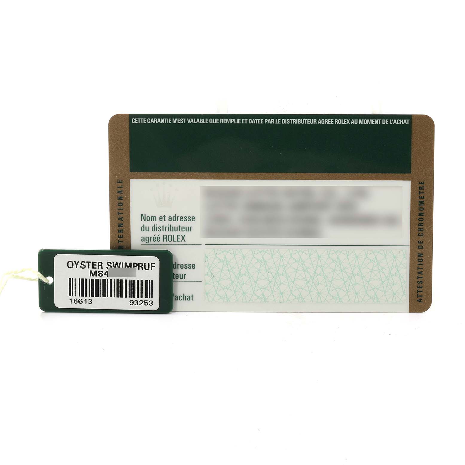 The image shows warranty documentation and a tag for a Rolex Submariner 16613 Men's Steel and Gold (two tone) Blue Dial 16613 Men's Steel and Gold (two tone) Blue Dial watch.