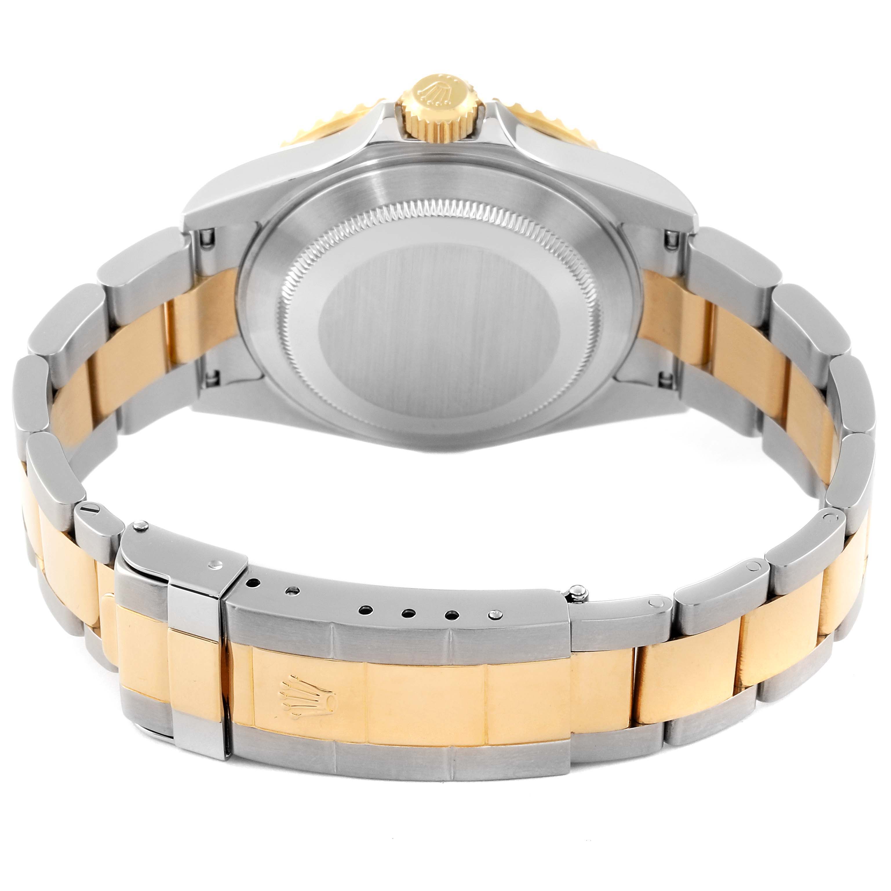 The image shows the back case and bracelet of a Rolex Submariner 16613 Men's Steel and Gold (two tone) Blue Dial 16613 Men's Steel and Gold (two tone) Blue Dial watch, highlighting its two-tone metal design.