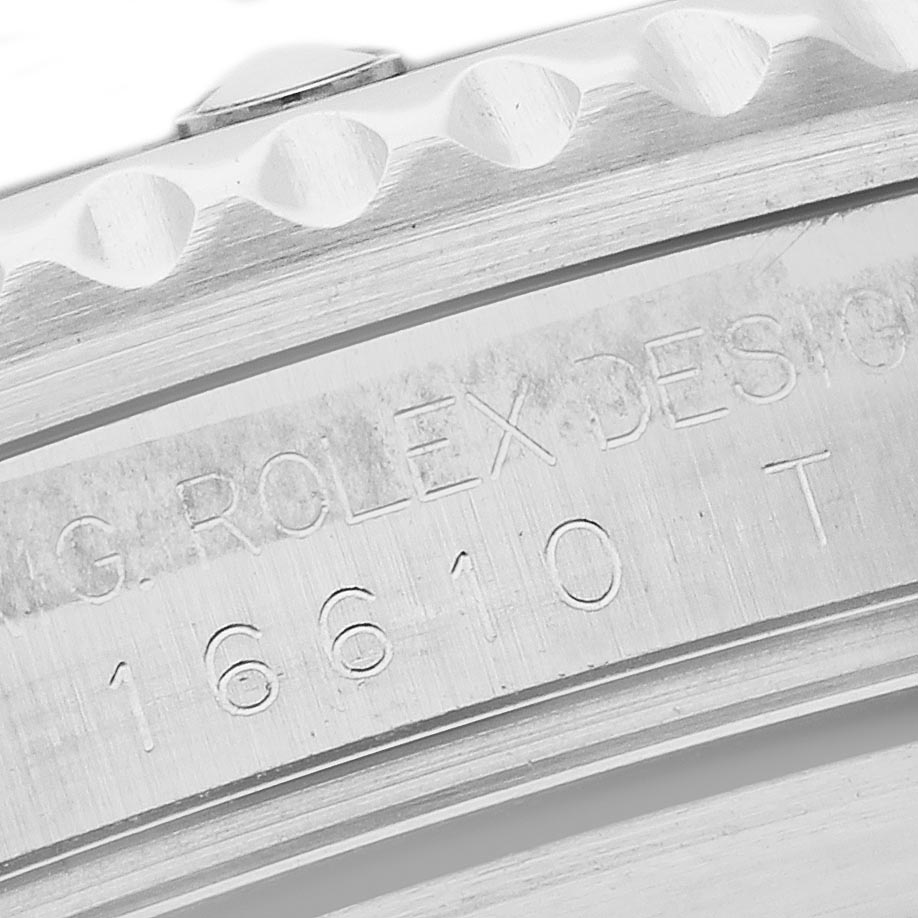 The image shows a close-up of the case side, engraving, and bezel edge of a Rolex Submariner 16610 Men's Stainless Steel Black Dial 16610 Men's Stainless Steel Black Dial, focusing on its serial number.