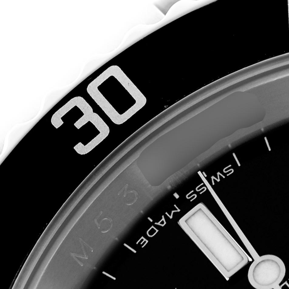 The image shows a close-up angle of a Rolex Submariner 16610 Men's Stainless Steel Black Dial 16610 Men's Stainless Steel Black Dial, highlighting part of the bezel and dial with the "30" minute mark visible.