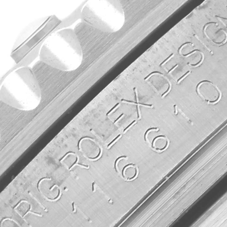 The image shows a close-up of the side of a Rolex Submariner 116610LV Men's Stainless Steel Green Dial 116610LV Men's Stainless Steel Green Dial, focusing on the bezel edge and engraved Rolex design markings.