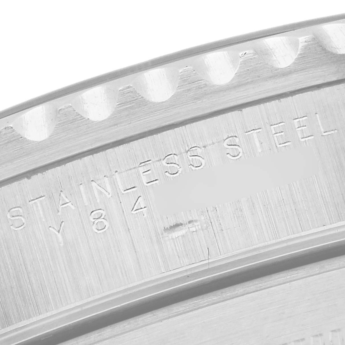 The image shows a close-up of the stainless steel watch case edge of a Rolex Submariner 14060 Men
s Stainless Steel Black Dial 14060 Men
s Stainless Steel Black Dial model.