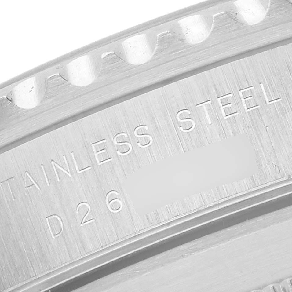 The image shows the engraved case back of a Rolex Submariner 14060 Men's Stainless Steel Black Dial 14060 Men's Stainless Steel Black Dial, highlighting "Stainless Steel."