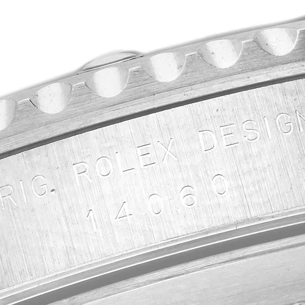 The image shows a close-up of the case side of a Rolex Submariner 14060 Men's Stainless Steel Black Dial 14060 Men's Stainless Steel Black Dial, highlighting the engraved model number and the design details.
