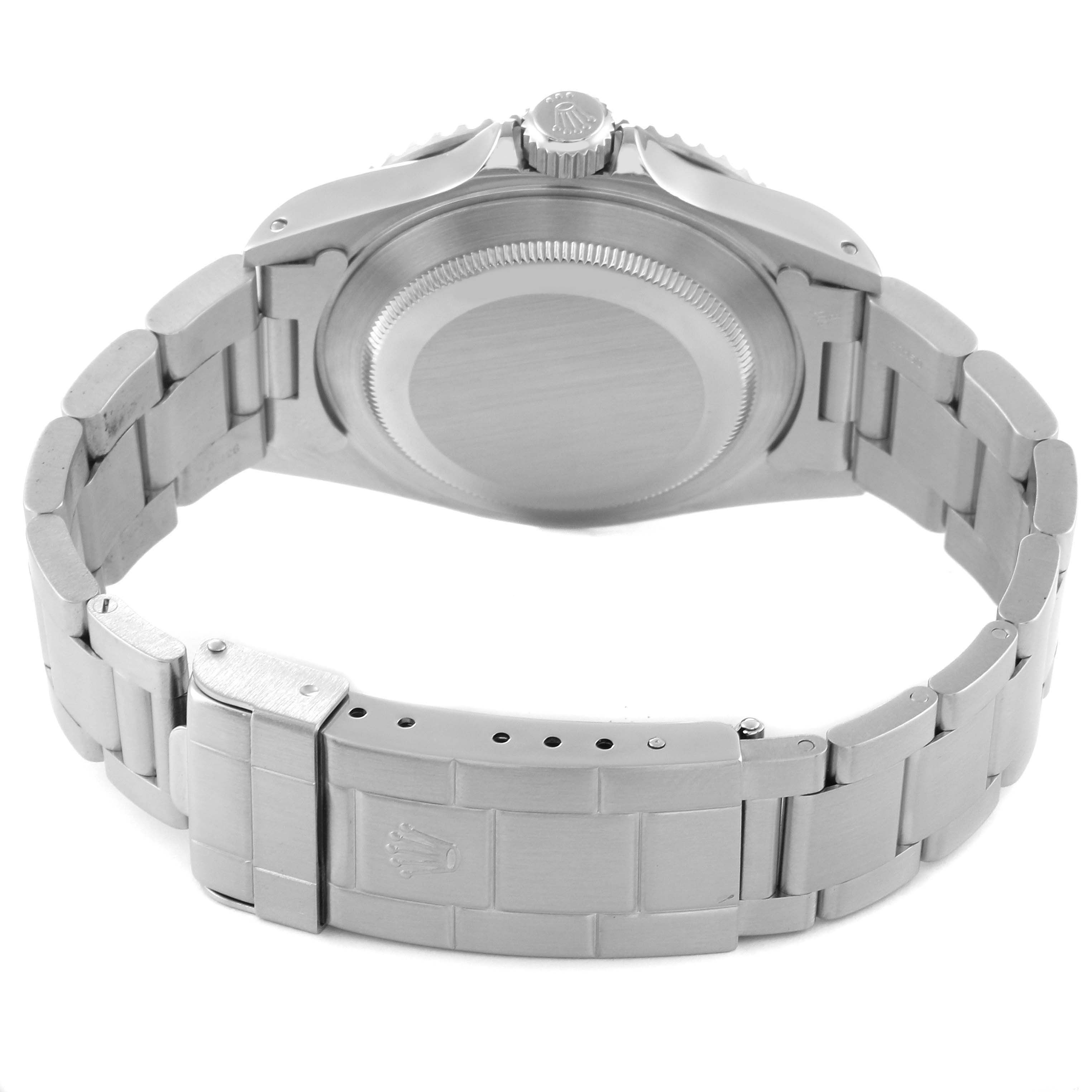 The image shows the back view of a Rolex Submariner 14060 Men
s Stainless Steel Black Dial 14060 Men
s Stainless Steel Black Dial watch, highlighting the bracelet, clasp, and case back.