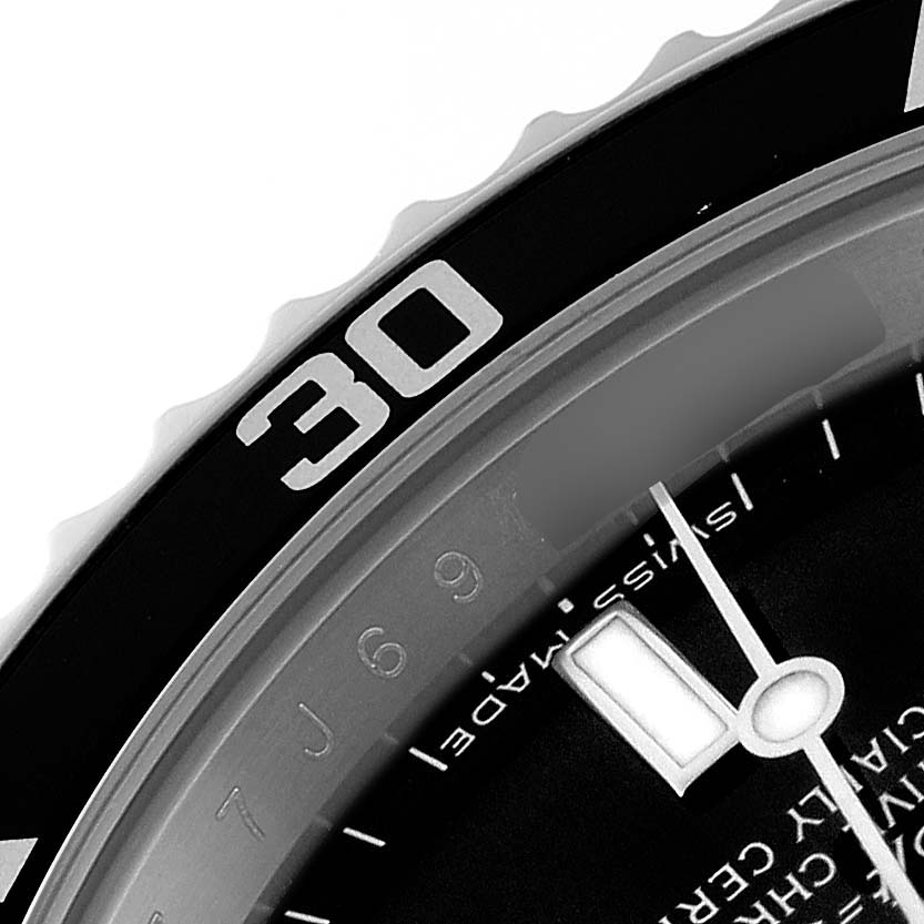 This image shows a close-up of the bezel, dial, and minute hand of a Rolex Submariner 14060 Men
s Stainless Steel Black Dial 14060 Men
s Stainless Steel Black Dial watch.