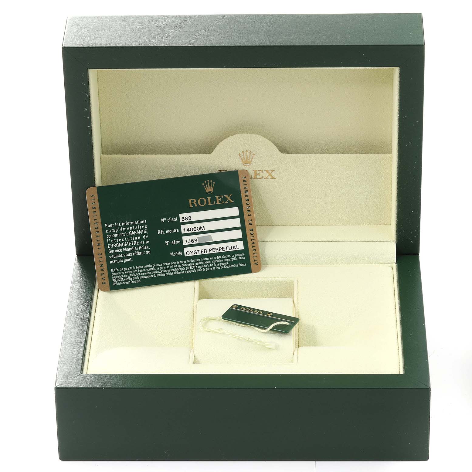 This image shows the interior of a Rolex Submariner 14060 Men
s Stainless Steel Black Dial 14060 Men
s Stainless Steel Black Dial watch box with warranty cards and tags.