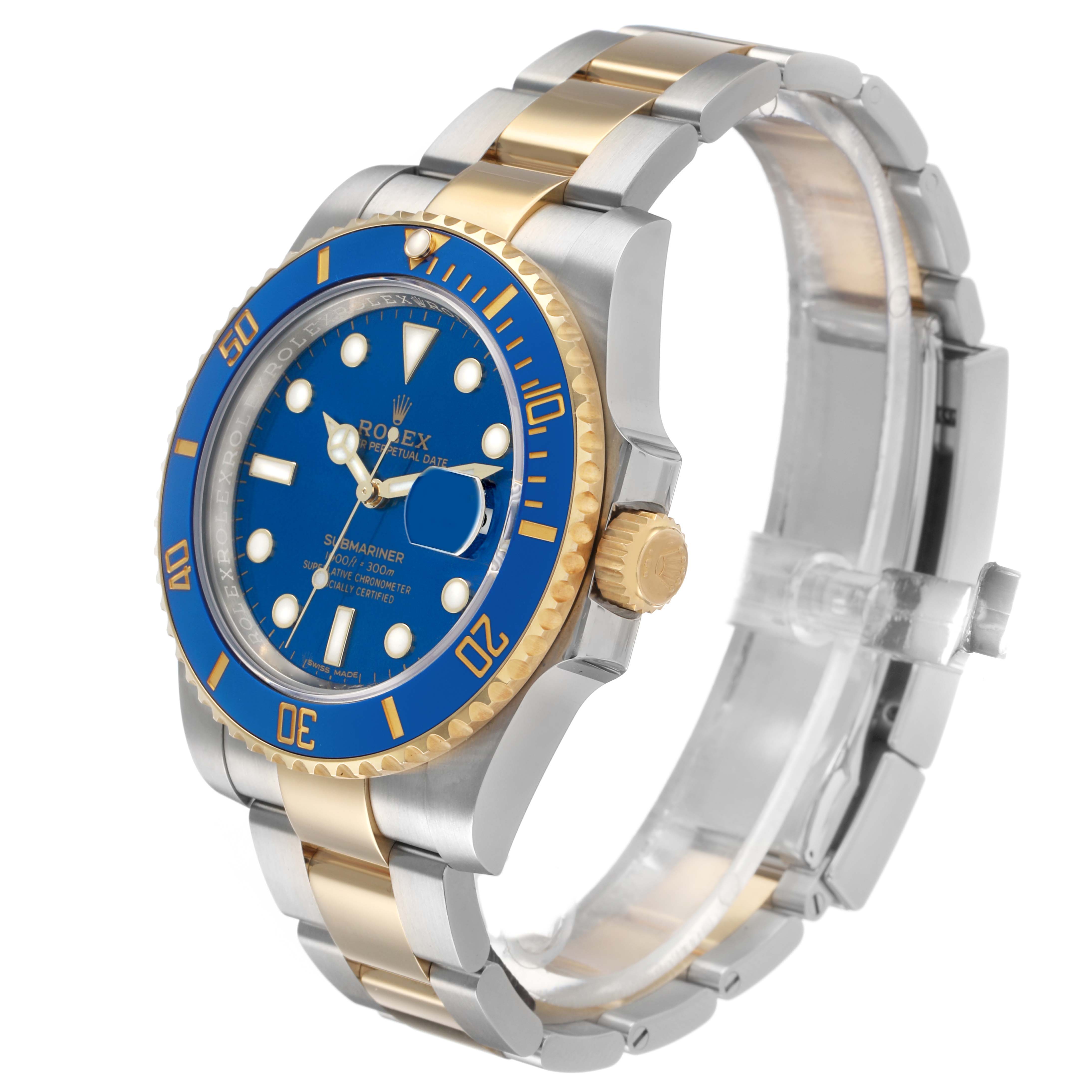 The Rolex Submariner 116613 Men's Steel and Gold (two tone) Blue Dial watch is shown at a three-quarter angle, displaying the blue dial, bezel, and two-tone bracelet.