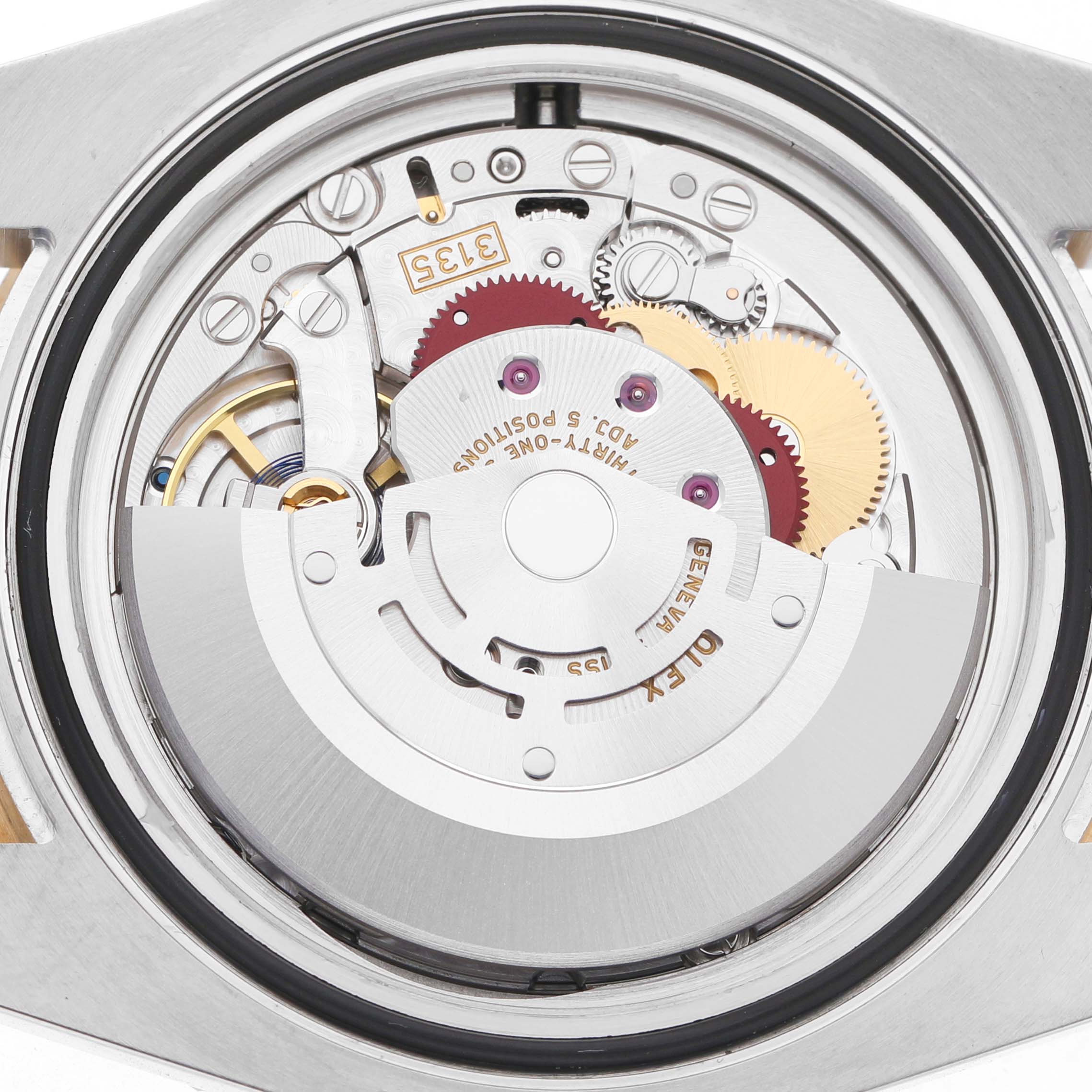The image shows the movement of a Rolex Submariner 116613 Men's Steel and Gold (two tone) Blue Dial watch, viewed from the back, highlighting gears and the rotor.