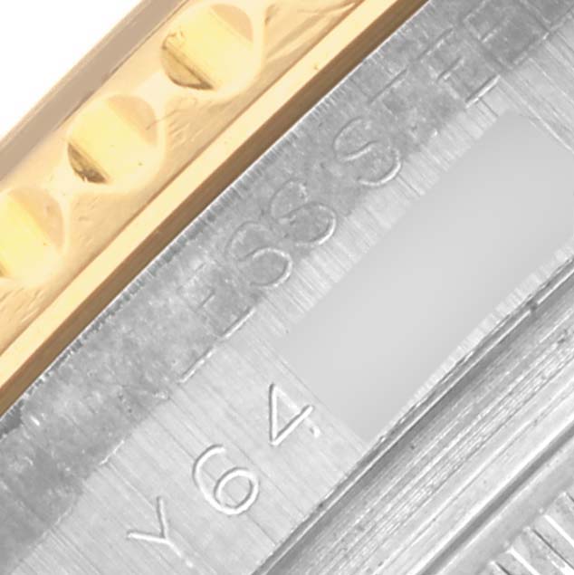 The image shows a close-up of the Rolex Yacht-Master 168623 Men's Steel and Gold (two tone) Blue Dial 168623 Men's Steel and Gold (two tone) Blue Dial's side, highlighting the bezel edge and part of the case with inscriptions.