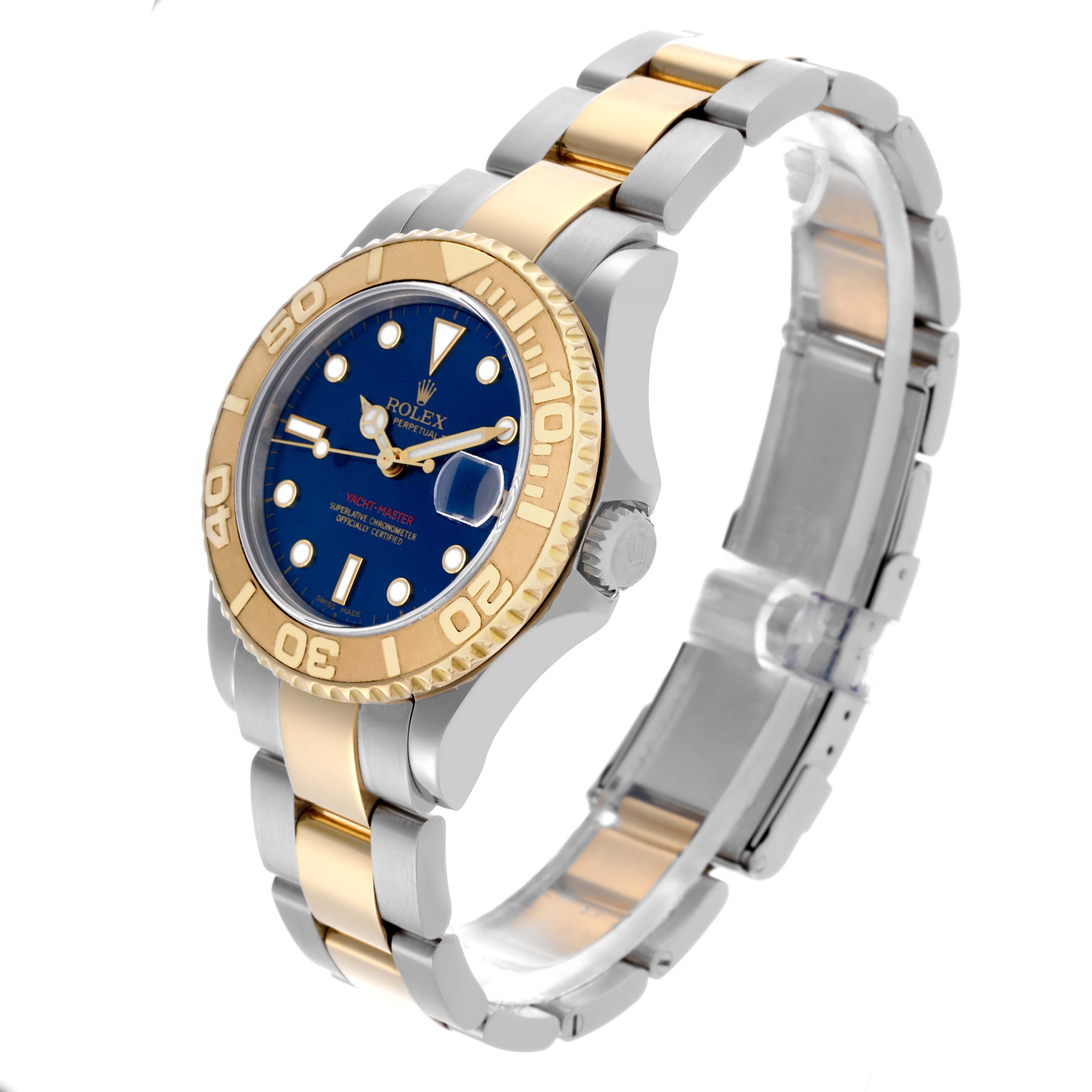The Rolex Yacht-Master 168623 Men's Steel and Gold (two tone) Blue Dial 168623 Men's Steel and Gold (two tone) Blue Dial watch is angled to show the face, bezel, case, crown, and partially opened bracelet.