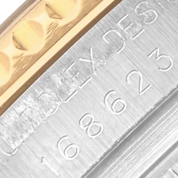 The image shows a close-up of the Yacht-Master Rolex bezel, highlighting the engraved numbers and textured edge.