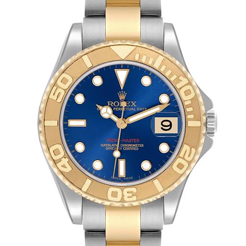 The Rolex Yacht-Master watch is shown from a top view, displaying the blue dial, gold bezel, and two-tone bracelet.