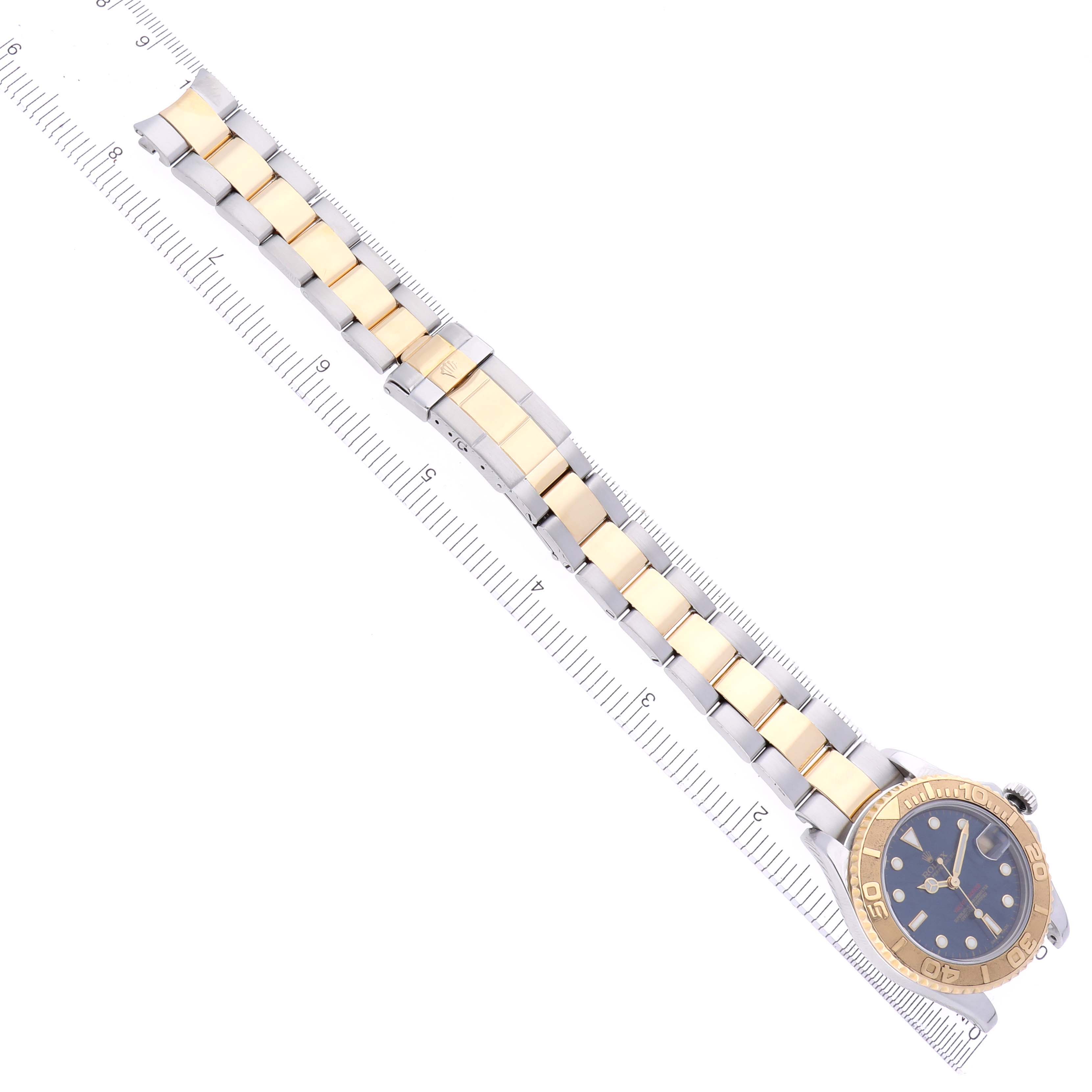The Rolex Yacht-Master 168623 Men's Steel and Gold (two tone) Blue Dial 168623 Men's Steel and Gold (two tone) Blue Dial watch is shown at an angled top view with its full bracelet and face visible.