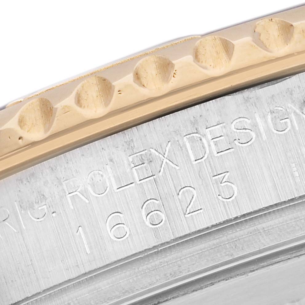 This close-up image shows the engraved side and bezel of a Rolex Yacht-Master 16623 Men's Steel and Gold (two tone) Grey Dial 16623 Men's Steel and Gold (two tone) Grey Dial model watch.