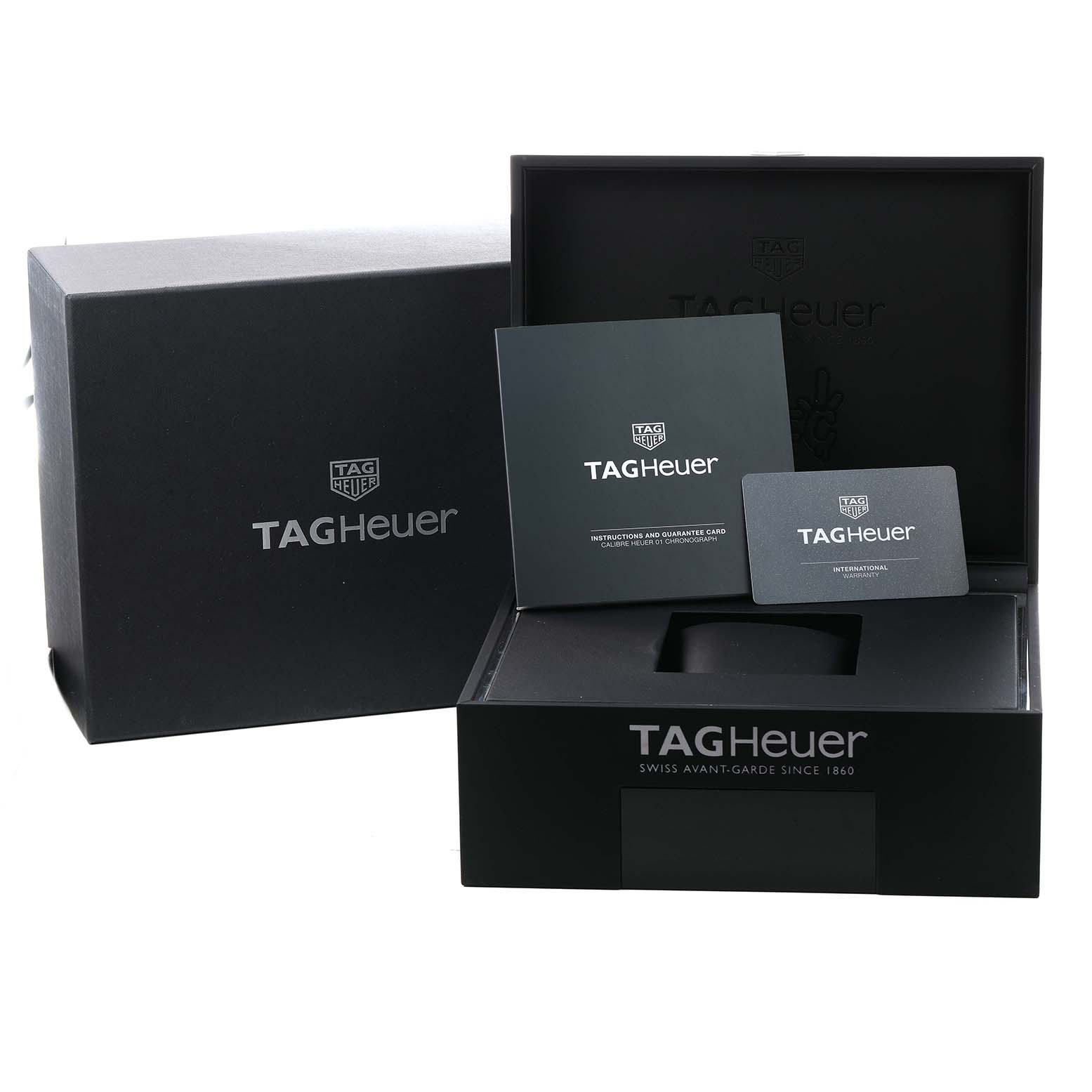The image shows the Tag Heuer Carrera CAR201AA.BA0714 Men's Stainless Steel White Dial watch packaging, including the box, instruction manual, and warranty card.