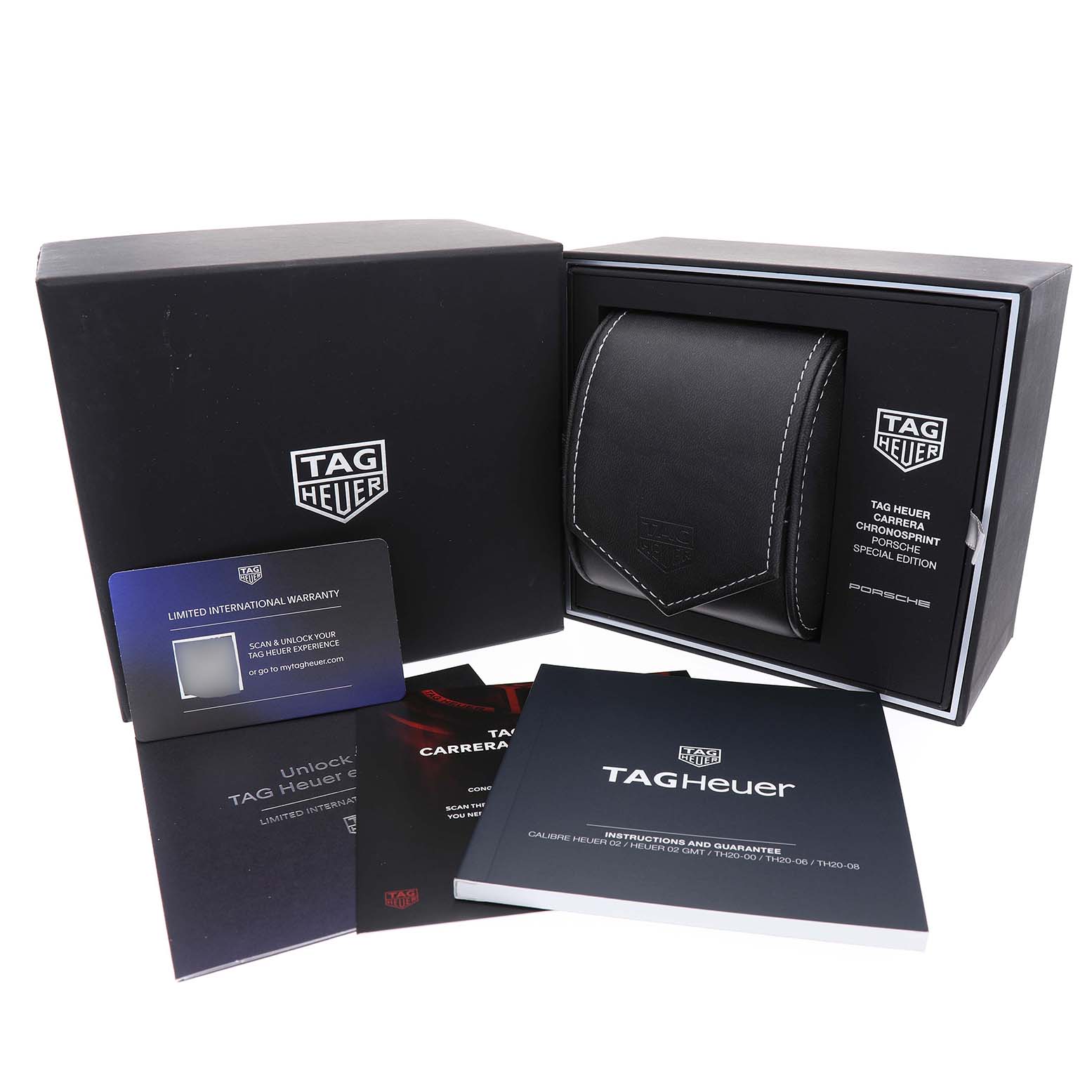 The image shows a watch box for a Tag Heuer Carrera CBS2011.FC6529 Men's Stainless Steel Silver Dial model at an angled view, with warranty cards and manuals displayed.
