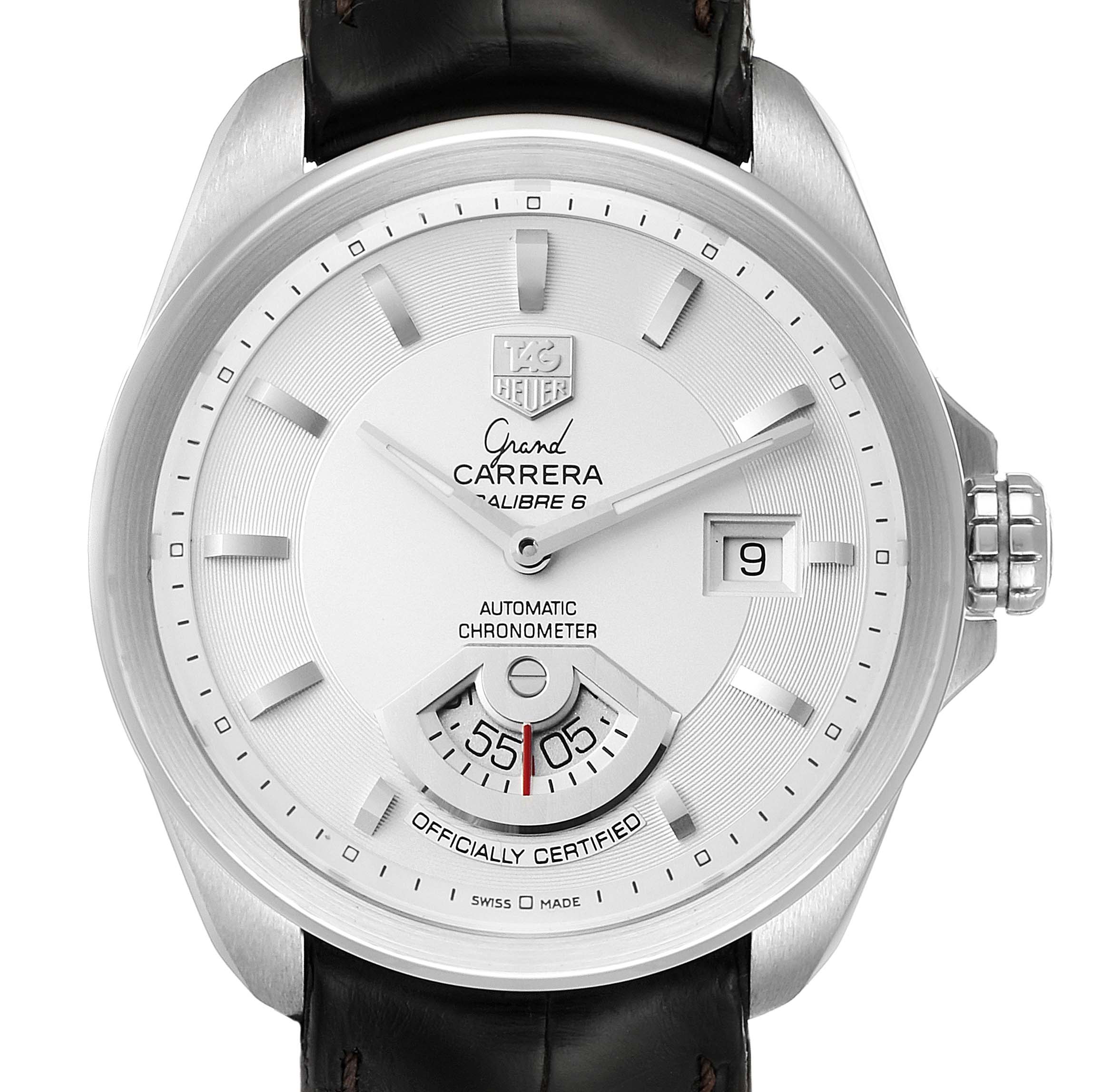 The Carrera model by Tag Heuer is shown from the front, displaying the dial, hands, date window, and part of the leather strap.