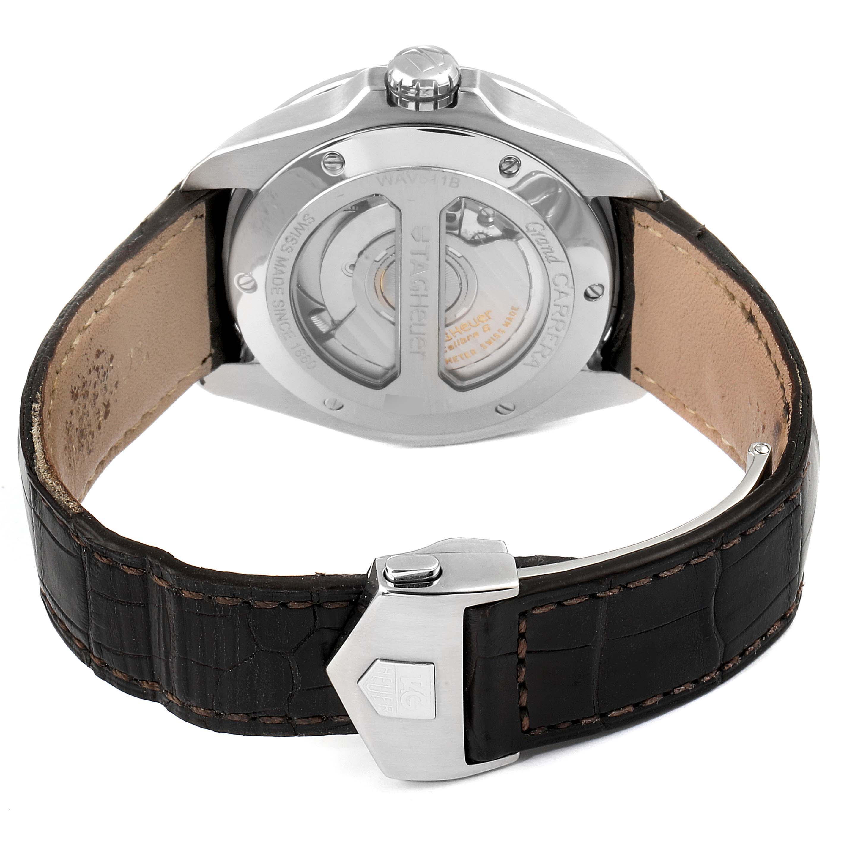 The image shows the back view of a Tag Heuer Carrera WAV511B.FC6224 Men's Stainless Steel Silver Dial WAV511B.FC6224 Men's Stainless Steel Silver Dial watch, displaying its movement and clasp on the leather strap.