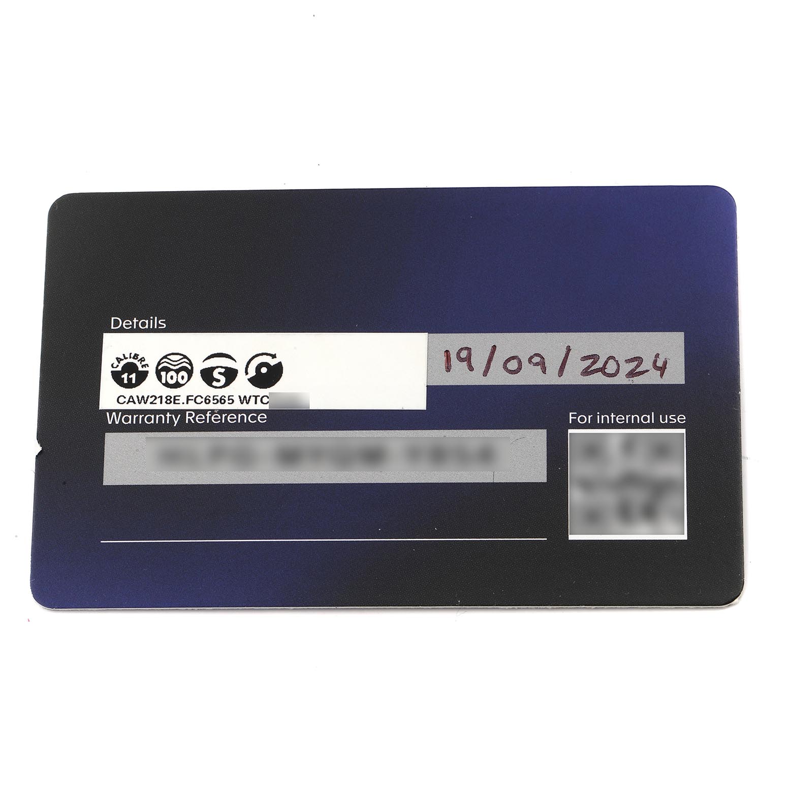 The image shows a warranty card for a Tag Heuer Monaco CAW218E.FC6565 Men's Titanium Silver Dial CAW218E.FC6565 Men's Titanium Silver Dial watch, featuring model details and a date.