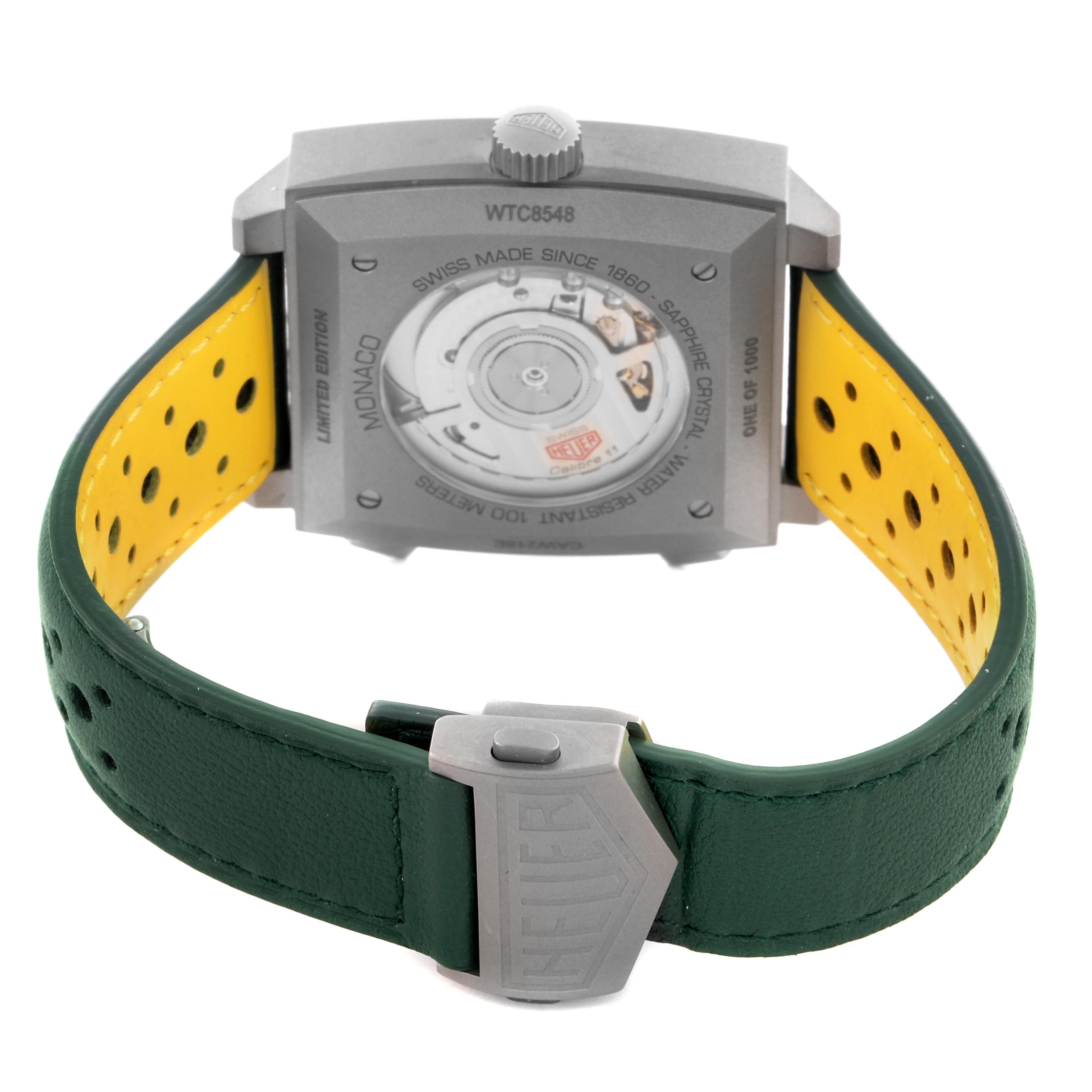 The image shows the back of the Tag Heuer Monaco CAW218E.FC6565 Men's Titanium Silver Dial CAW218E.FC6565 Men's Titanium Silver Dial watch, highlighting the case back and perforated strap.