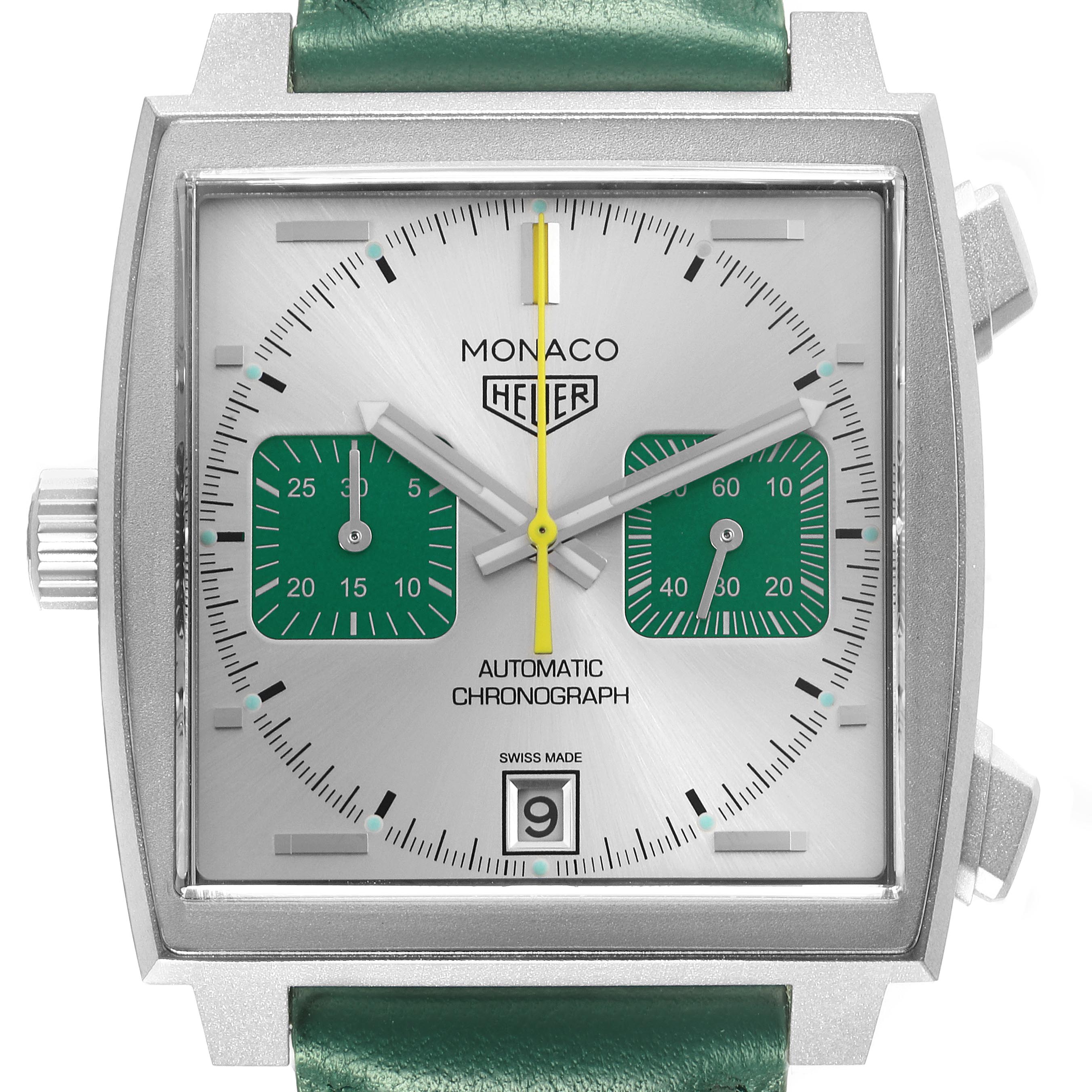 The Tag Heuer Monaco CAW218E.FC6565 Men's Titanium Silver Dial CAW218E.FC6565 Men's Titanium Silver Dial watch is shown from the front, displaying its dial, green subdials, and crown on the left side.