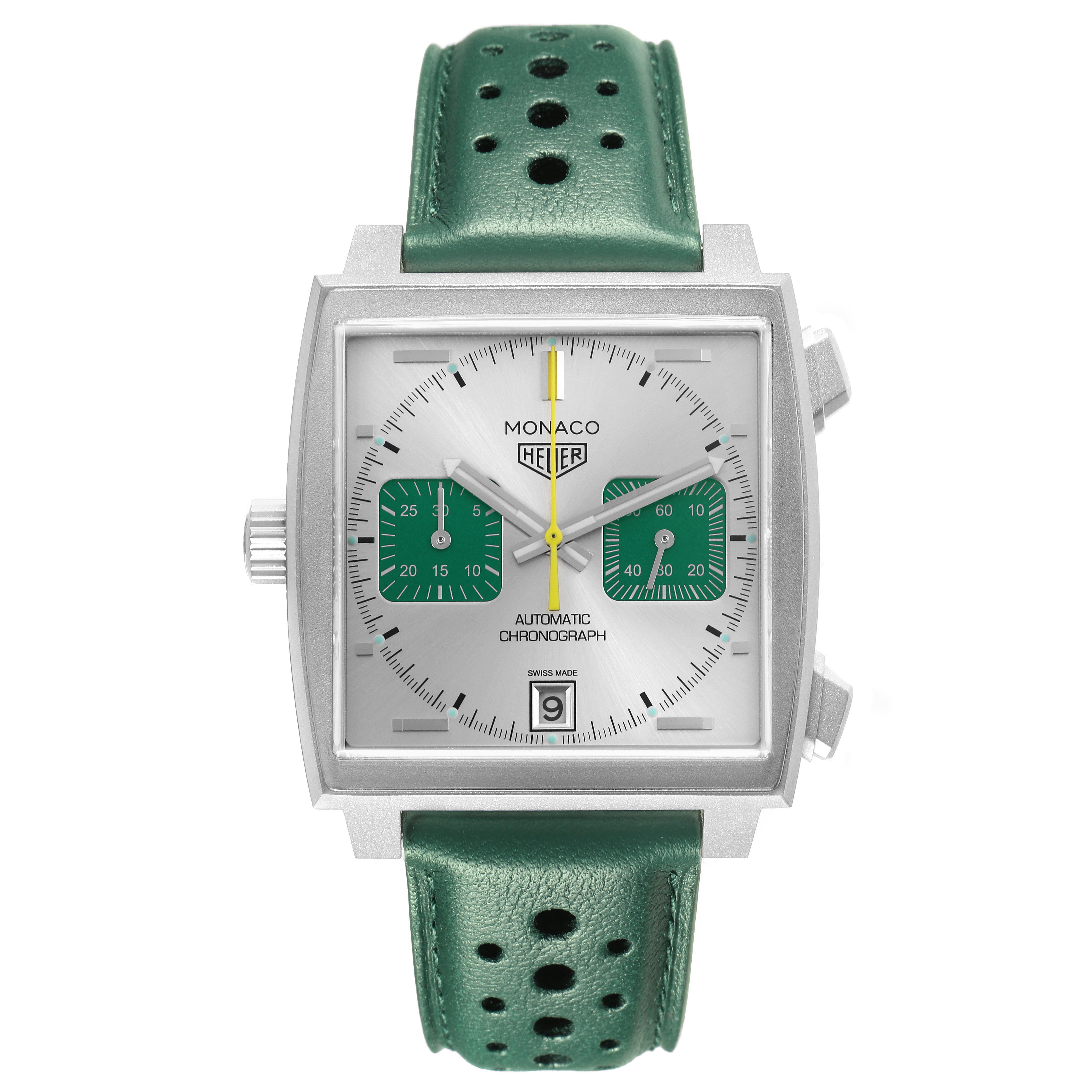 The image shows a front view of the Tag Heuer Monaco CAW218E.FC6565 Men's Titanium Silver Dial watch, displaying its square face and green strap.