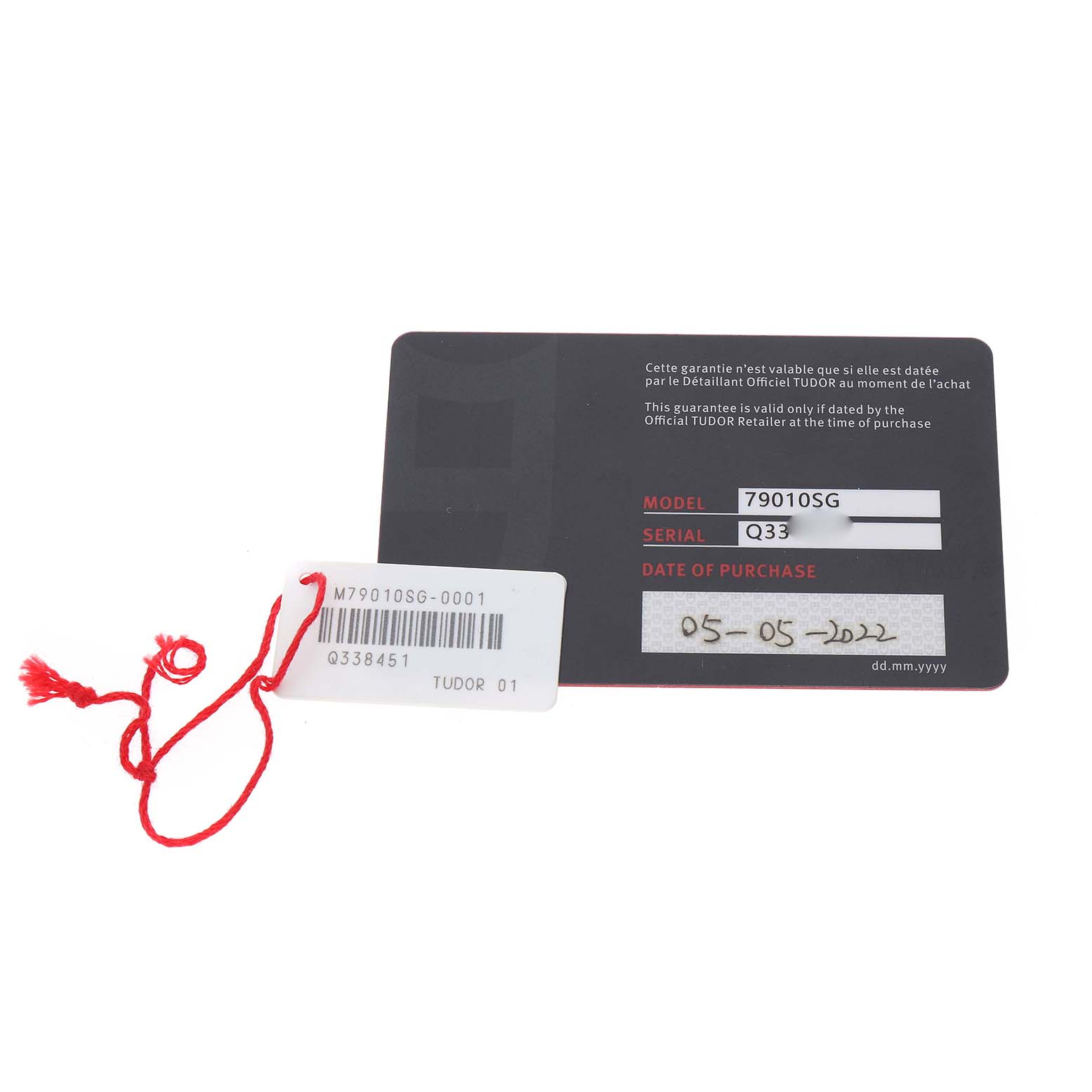 The image shows a warranty card and tag for the Tudor Heritage Black Bay 79010 Men's Stainless Steel Grey Dial model.