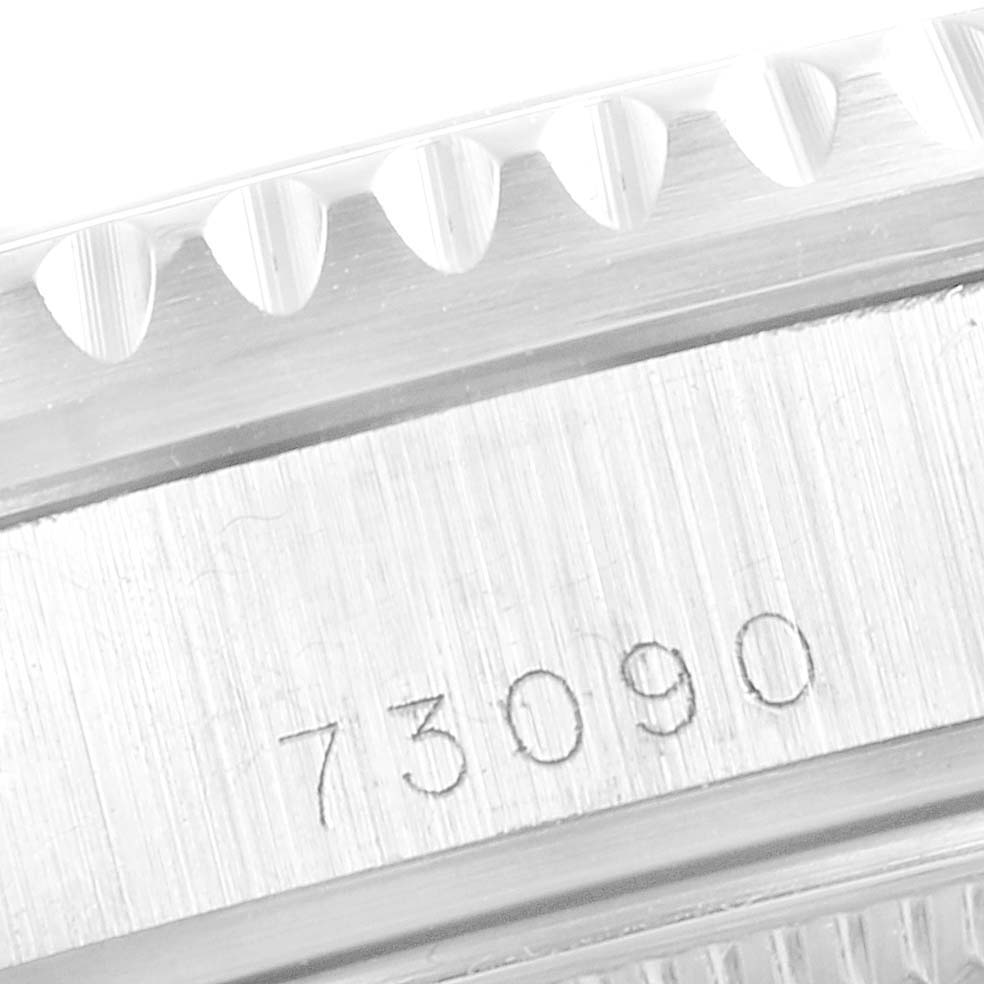 This image shows a close-up of the Tudor Prince model 73090 watch's case with part of the bezel and engraved model number.