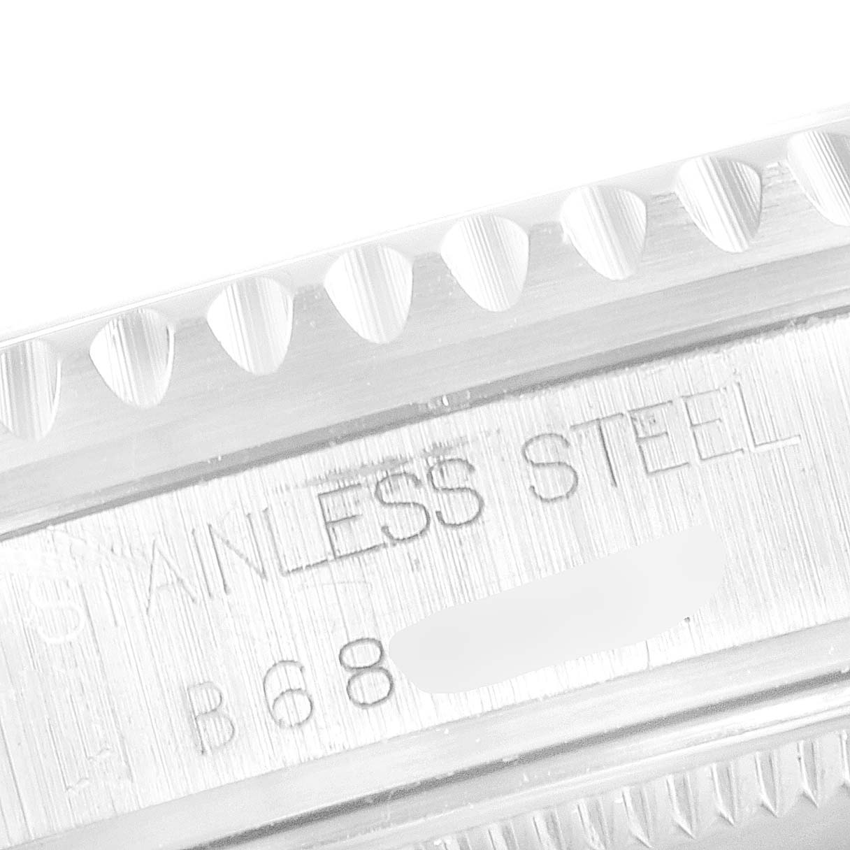 This close-up of the Tudor Prince model watch shows the textured bezel and the engraved stainless steel case back.