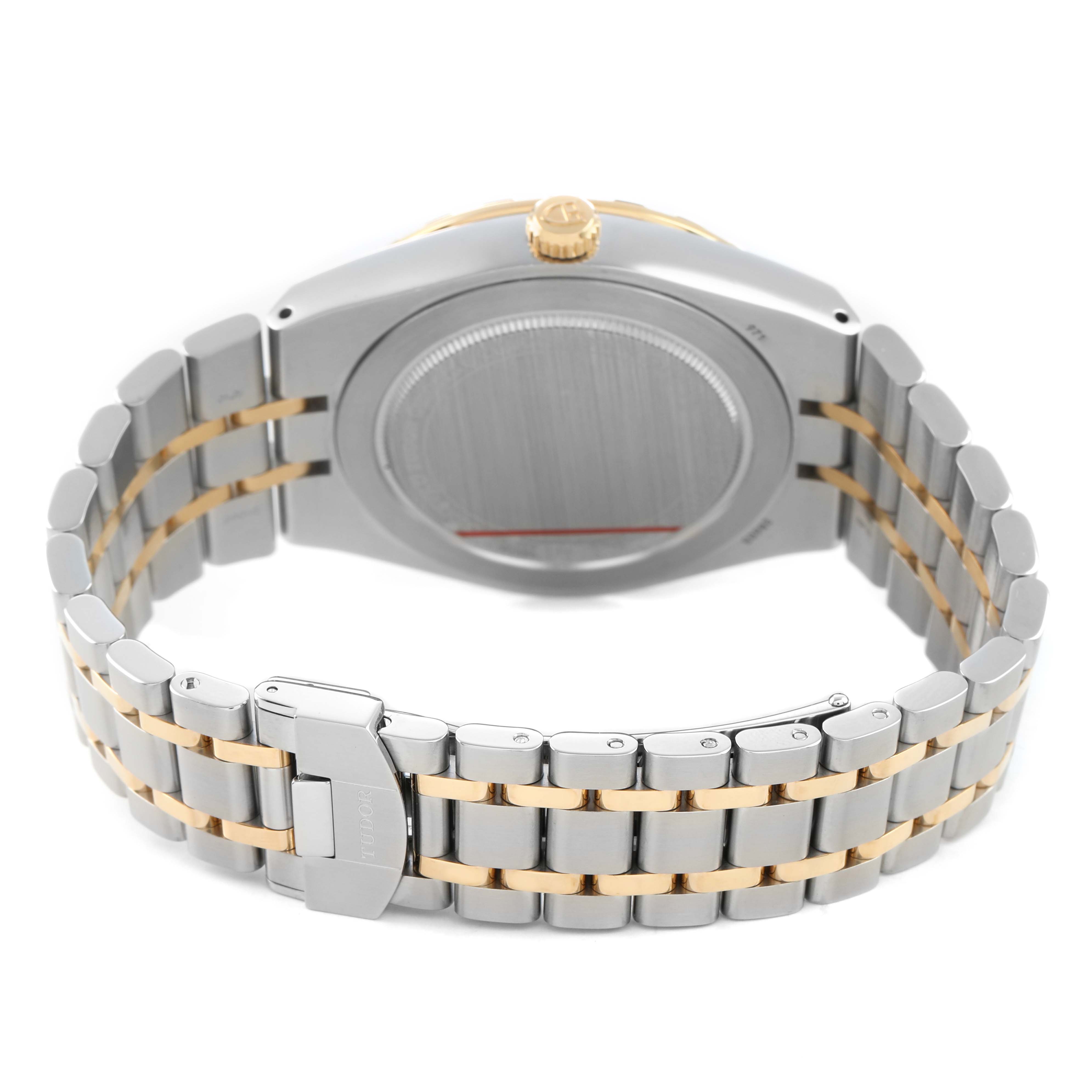 The Tudor Royal 28603 Men's Stainless Steel Champagne Dial watch is shown from the back, highlighting the bracelet, clasp, and case back.