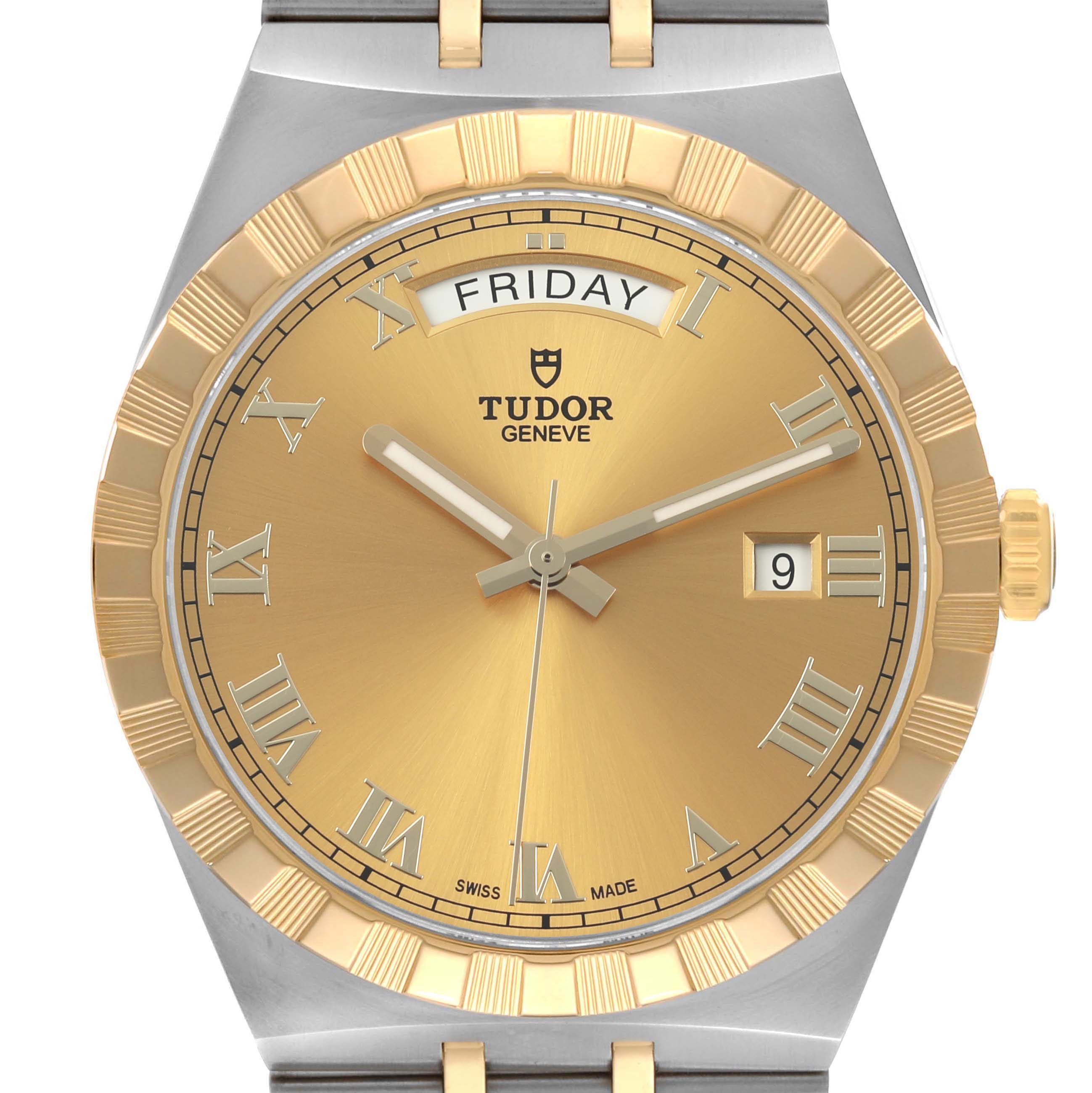 The image shows a front view of the Tudor Royal 28603 Men's Stainless Steel Champagne Dial model, featuring a gold dial, day and date indicators, and a fluted bezel.