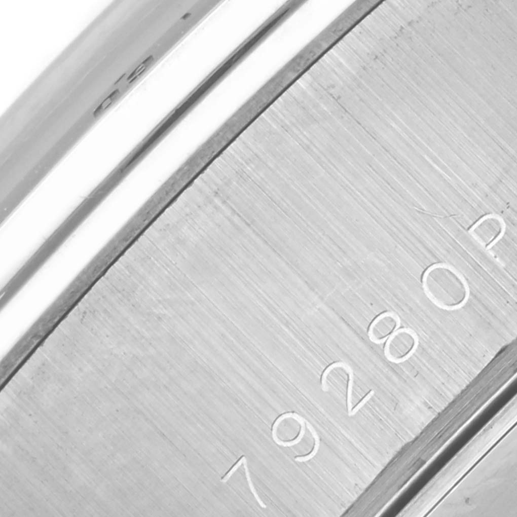 The image shows a close-up of the Tiger model by Tudor, focusing on the engraved side of the watch case or bezel.