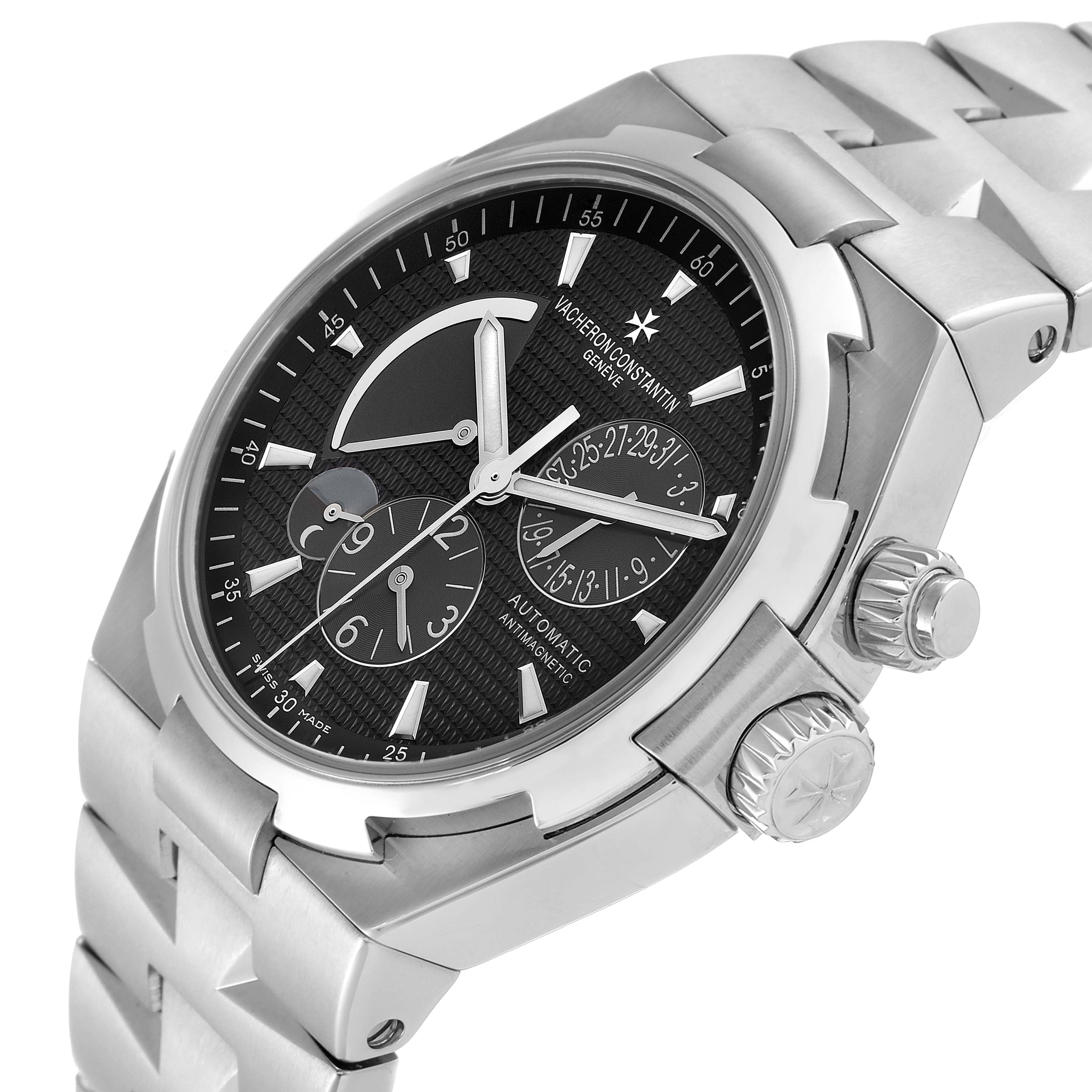 The image shows a Vacheron Constantin Overseas 47450/B01A Men's Stainless Steel Black Dial 47450/B01A Men's Stainless Steel Black Dial watch at a three-quarter angle, highlighting the dial and crown.