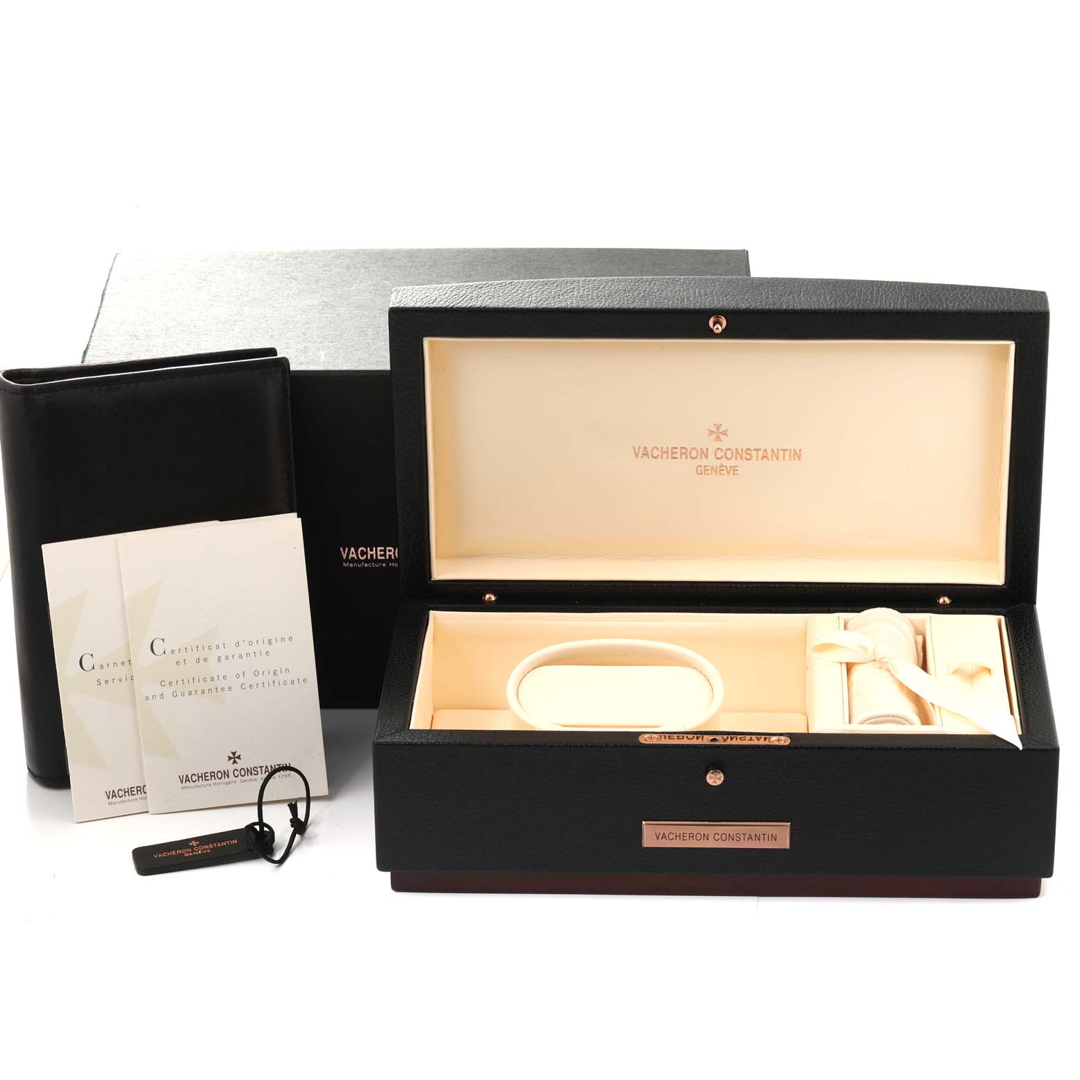 The image shows a Vacheron Constantin Overseas 47450/B01A Men's Stainless Steel Black Dial 47450/B01A Men's Stainless Steel Black Dial watch box, certificates, a tag, and a carrying pouch from a top-front angle.