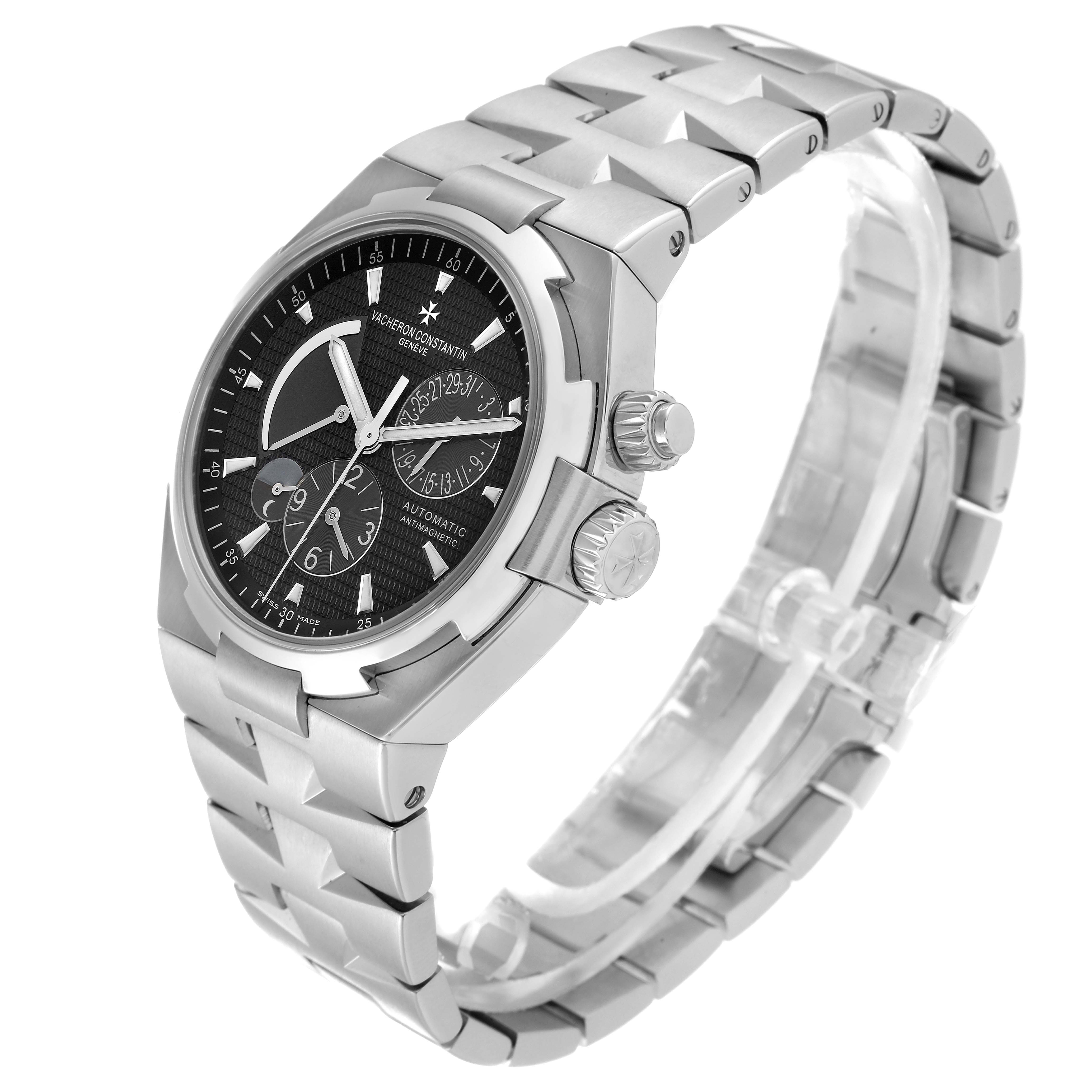 The Vacheron Constantin Overseas 47450/B01A Men's Stainless Steel Black Dial 47450/B01A Men's Stainless Steel Black Dial watch is shown at a three-quarter angle, highlighting its face, bracelet, and crown.