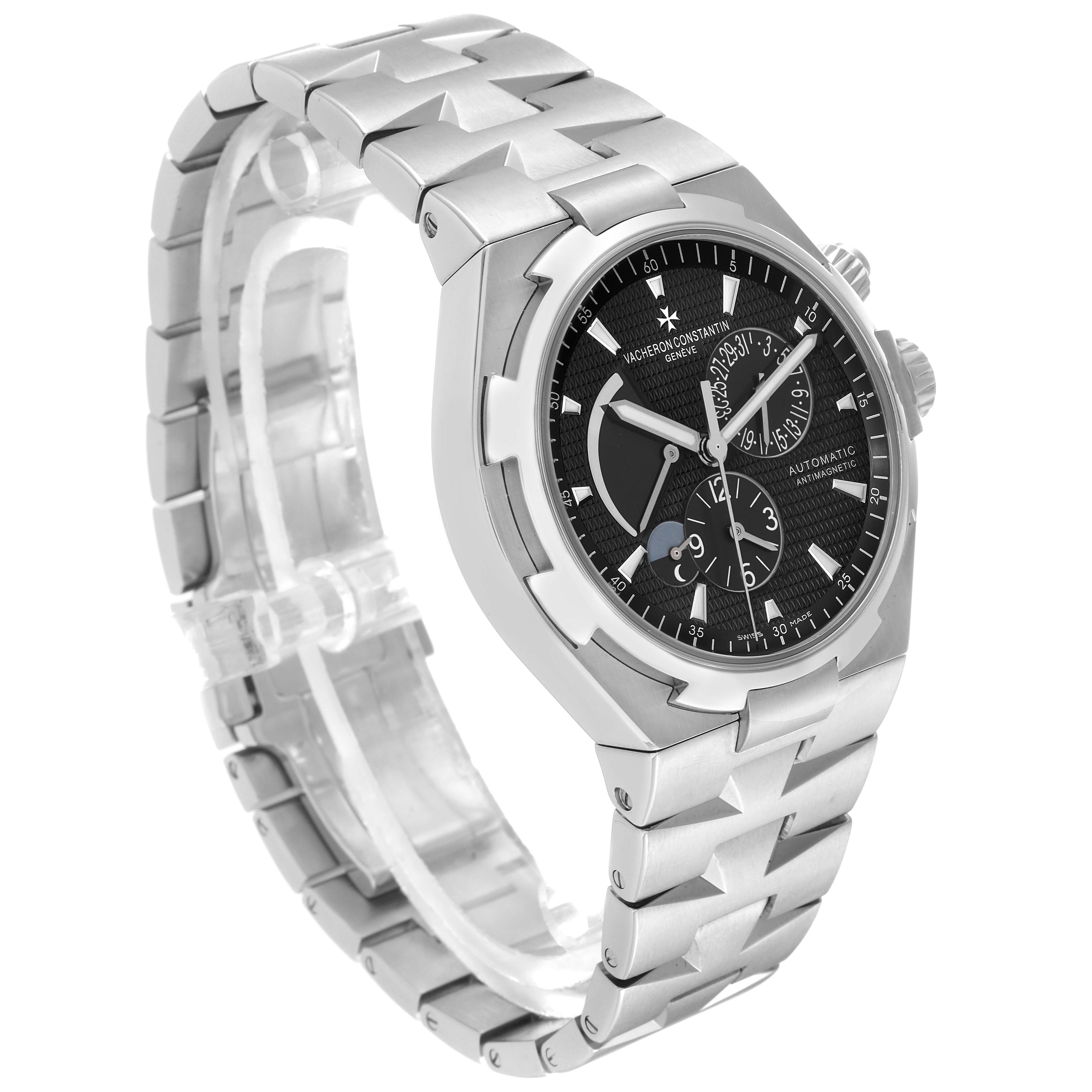 The Vacheron Constantin Overseas 47450/B01A Men's Stainless Steel Black Dial 47450/B01A Men's Stainless Steel Black Dial watch is shown at a three-quarter angle, highlighting the face, bracelet, and side profiles.