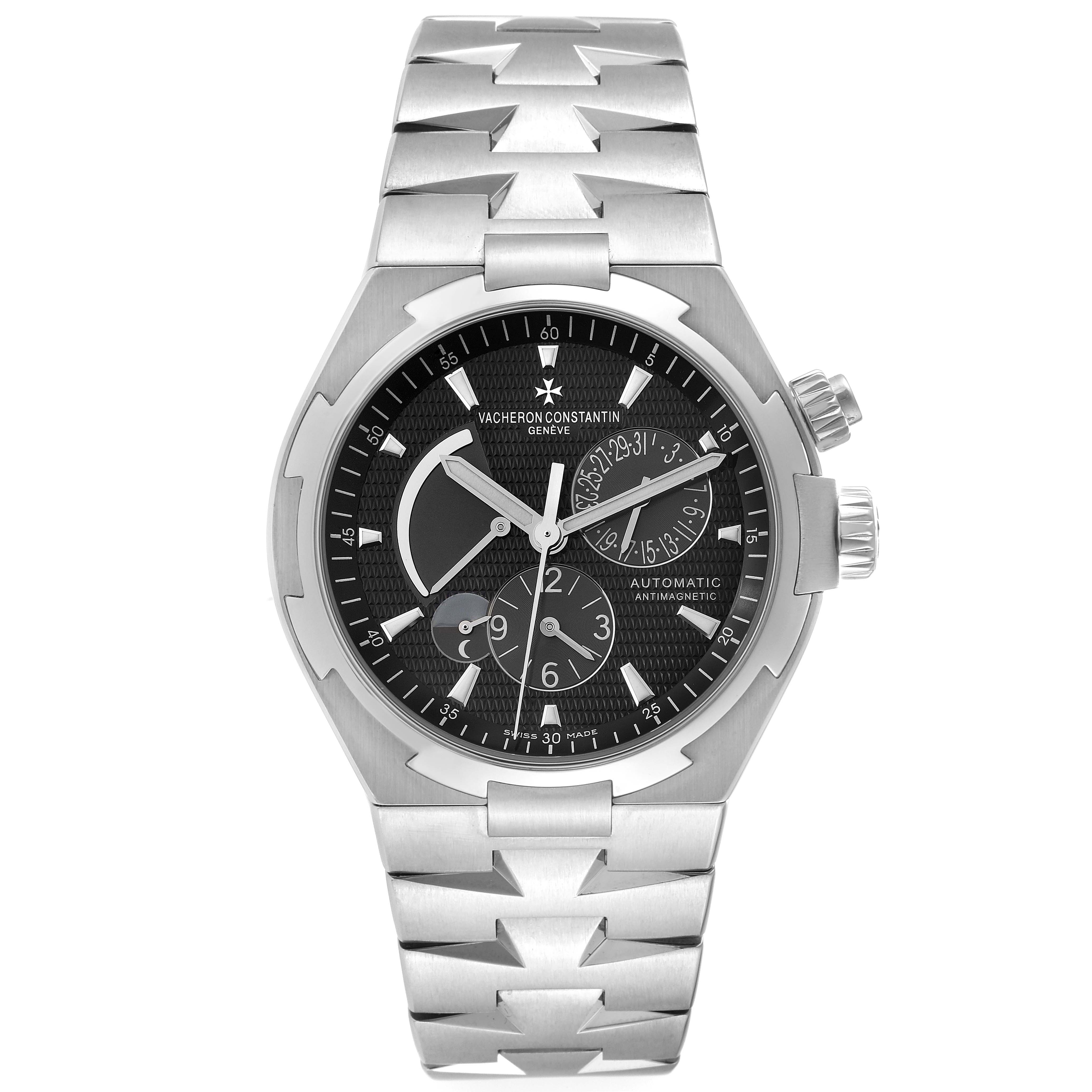 The image shows a frontal view of a Vacheron Constantin Overseas 47450/B01A Men's Stainless Steel Black Dial 47450/B01A Men's Stainless Steel Black Dial model with a stainless steel bracelet and multiple subdials.