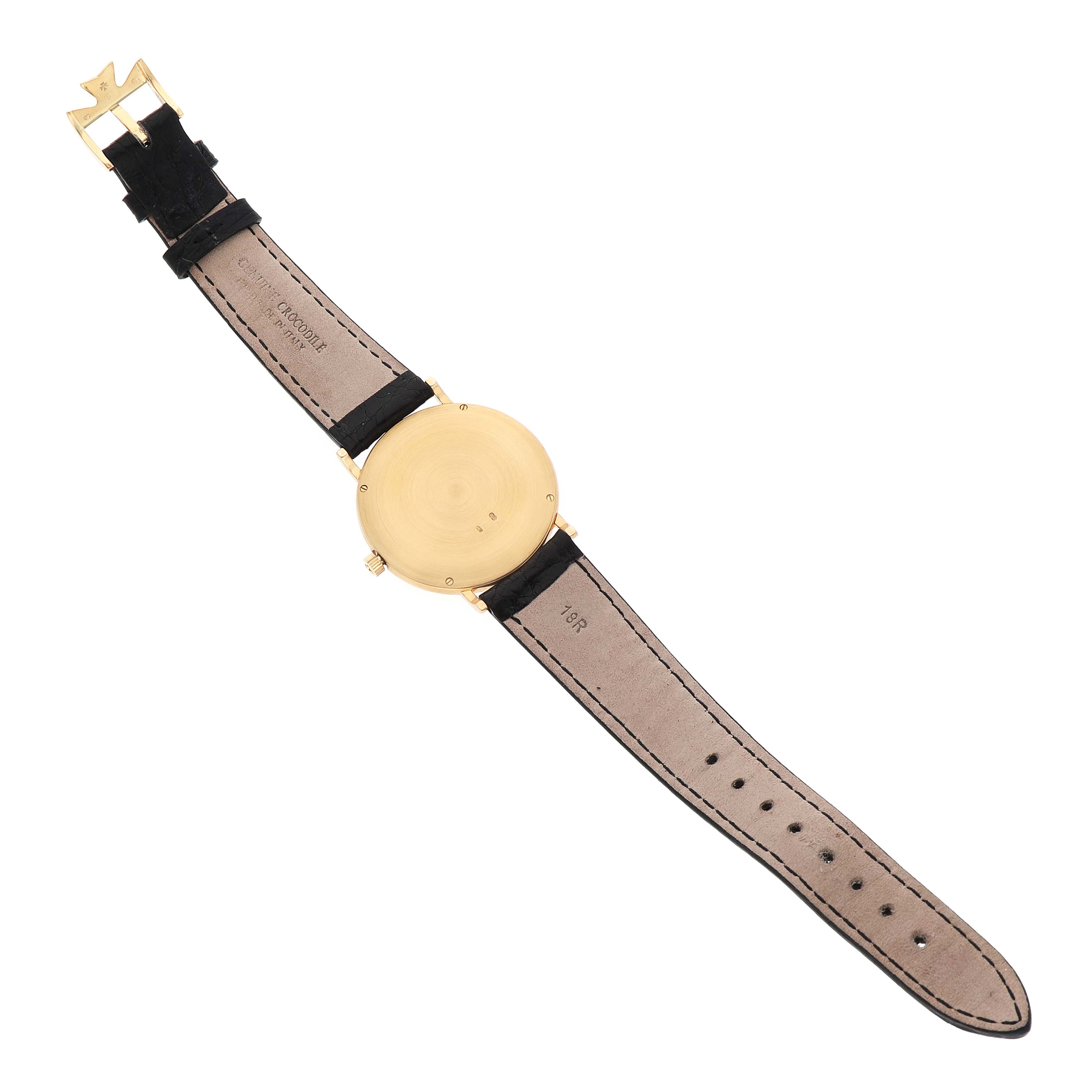 The Vacheron Constantin Patrimony 92238 Men's Yellow Gold Champagne Dial watch is shown from the back, displaying the case back, leather strap, and buckle.