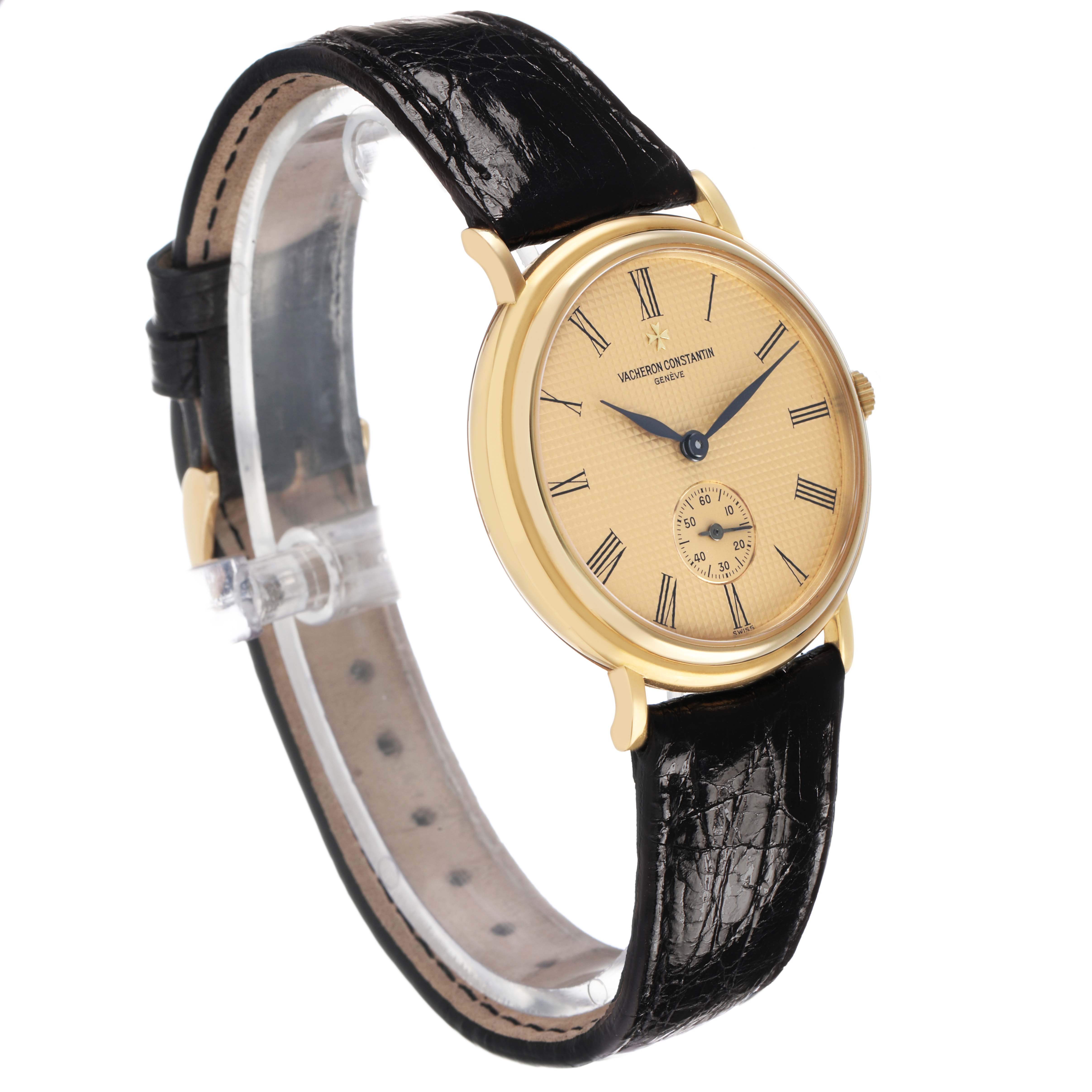 The Vacheron Constantin Patrimony 92238 Men's Yellow Gold Champagne Dial watch is shown at a side angle, displaying its round gold case, beige dial, Roman numerals, and black leather strap.
