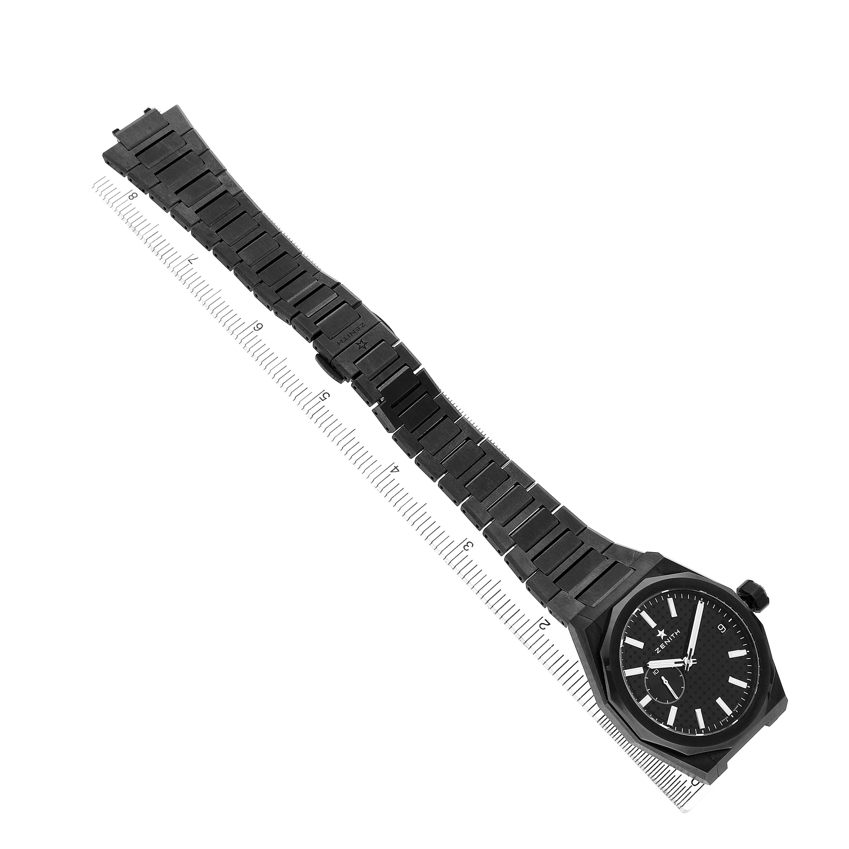 The Zenith Defy 49.9300.3620 Men's Ceramic Black Dial watch is shown from an angled top-down view, displaying the full bracelet, face, and side profile.
