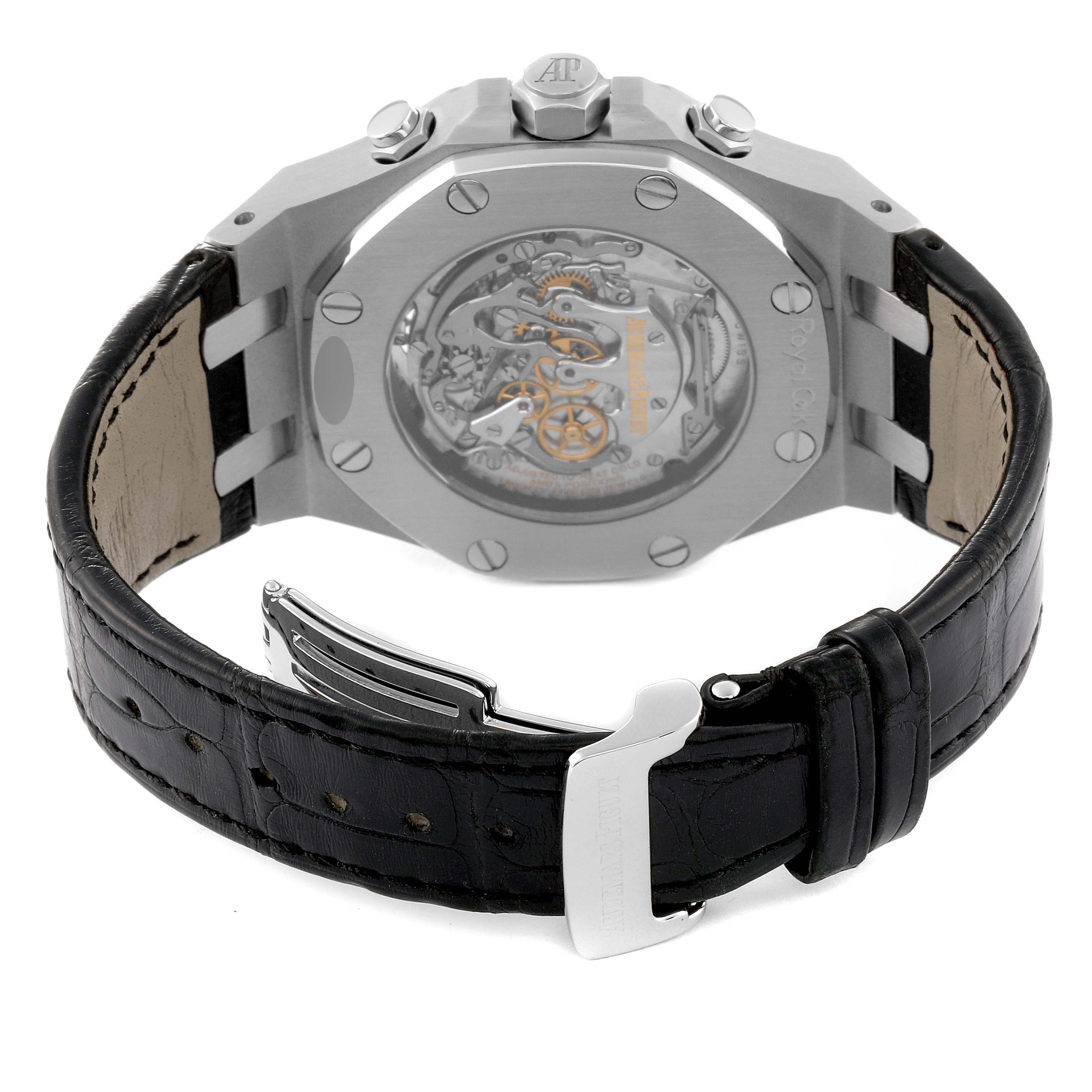 The image shows the back view of an Audemars Piguet Royal Oak 25977ST.OO.D002CR.01 Men's Stainless Steel Black Dial 25977ST.OO.D002CR.01 Men's Stainless Steel Black Dial watch, highlighting its open case back and leather strap with a buckle.