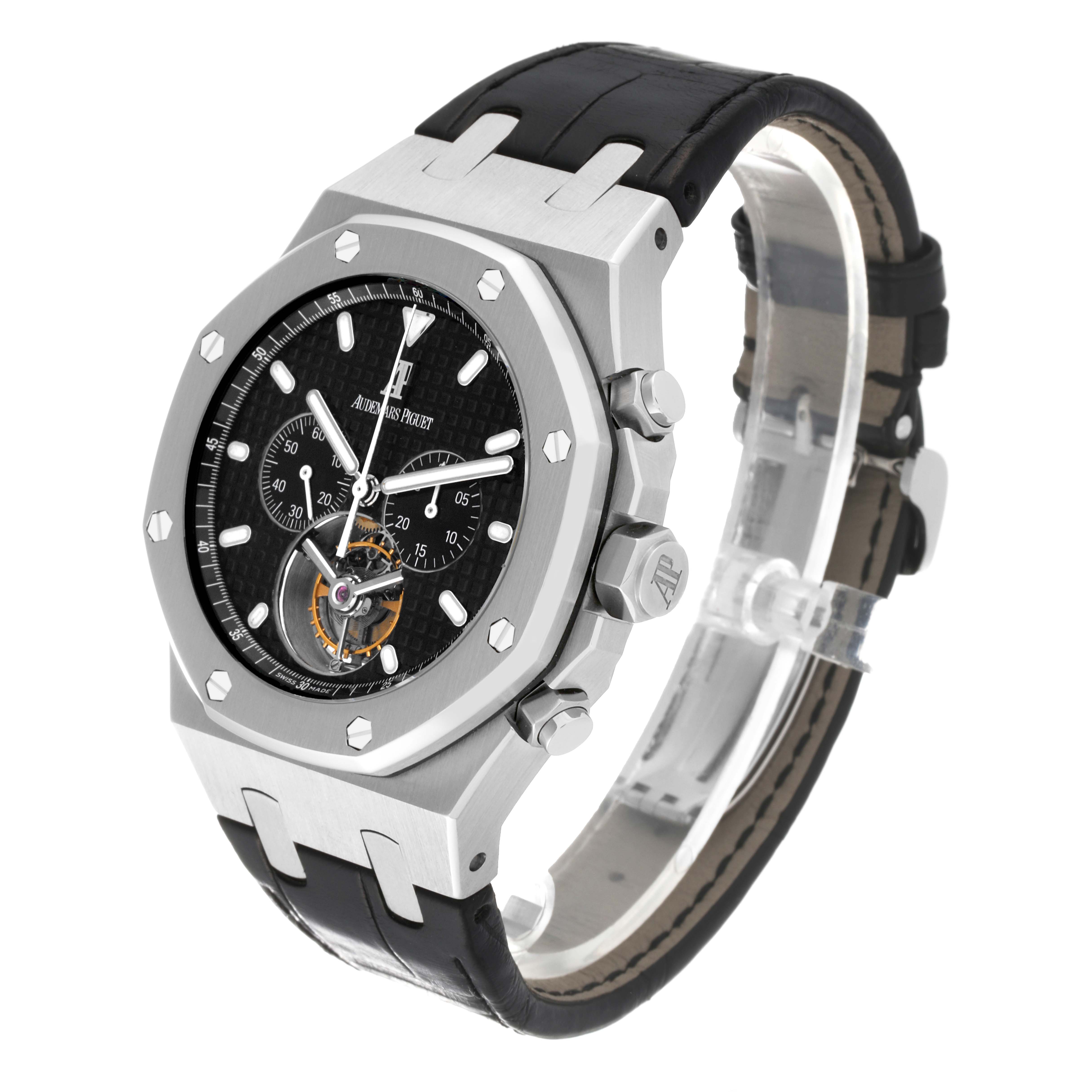 The image shows an Audemars Piguet Royal Oak 25977ST.OO.D002CR.01 Men's Stainless Steel Black Dial 25977ST.OO.D002CR.01 Men's Stainless Steel Black Dial watch at a three-quarter angle, highlighting its black leather strap, hexagonal bezel, and black dial with subdials.