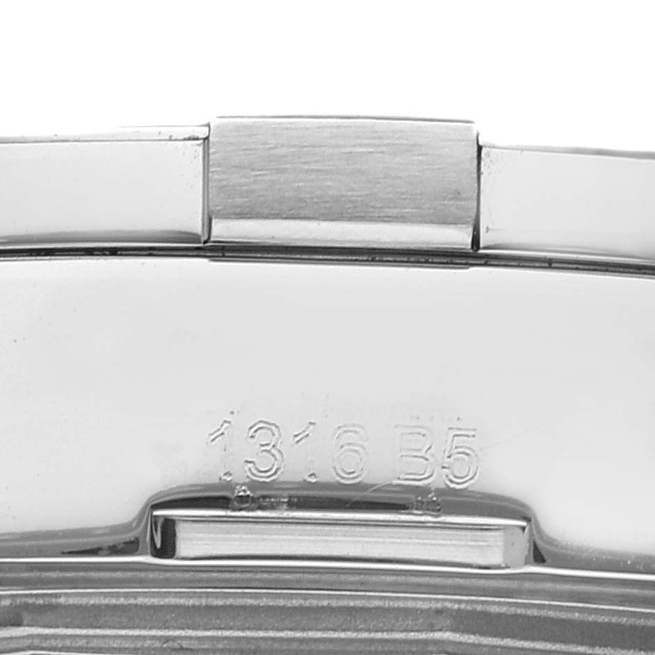 This image shows the clasp of a Breitling Avenger A32390 Men's Stainless Steel Mother of Pearl Dial A32390 Men's Stainless Steel Mother of Pearl Dial watch, viewed closely to display part of its serial number.