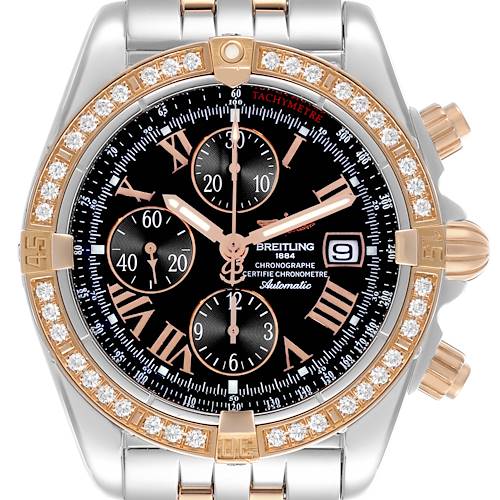 The Breitling Chronomat watch is shown from a top-down angle, highlighting its bezel, dial, and bracelet.