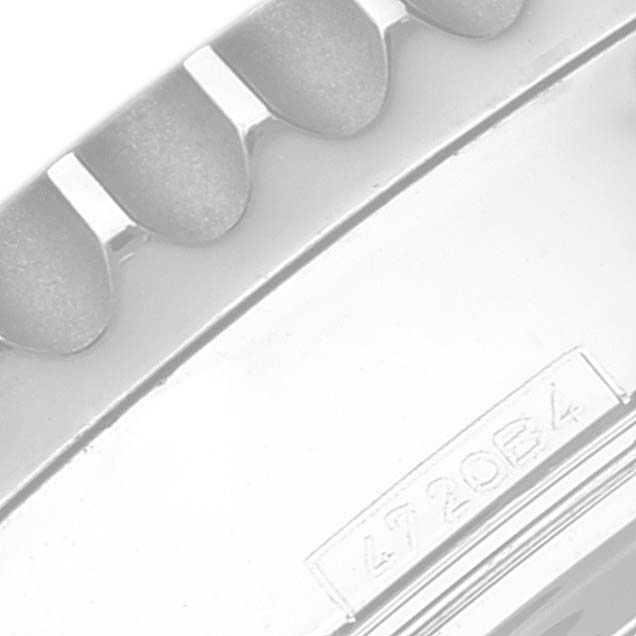 This is a close-up of the bezel and case back of a Breitling Navitimer AB0121 Men
s Stainless Steel Mother of Pearl Dial AB0121 Men
s Stainless Steel Mother of Pearl Dial watch, showing part of the serial number.