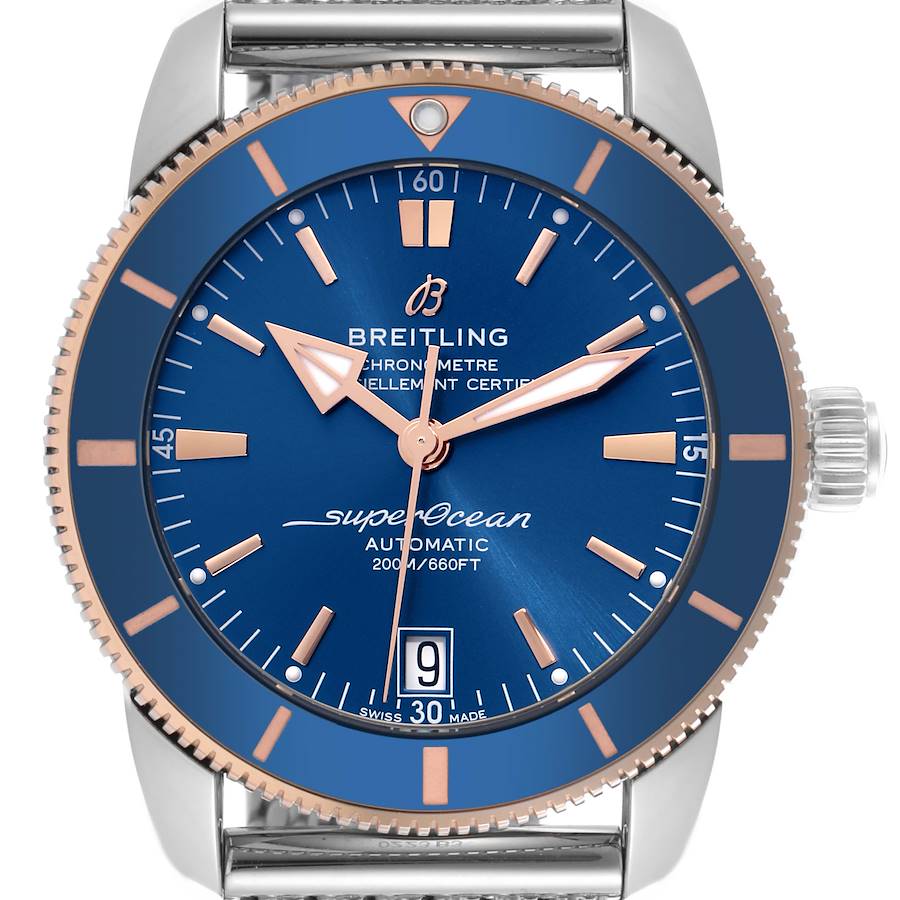 The Breitling Superocean watch is shown from the front, highlighting its blue dial, bezel, and hands, including the crown and lugs.